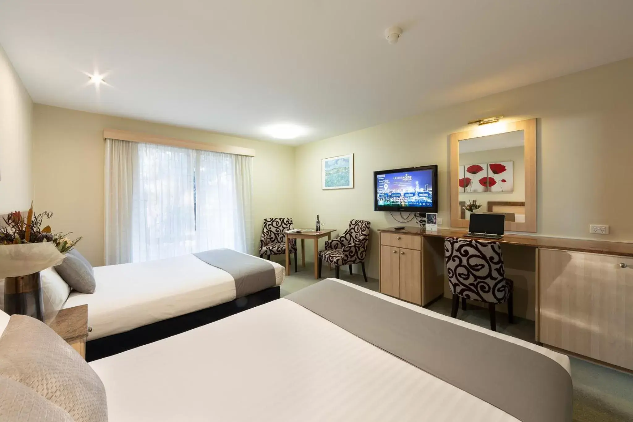 Bed, TV/Entertainment Center in ibis Styles Canberra