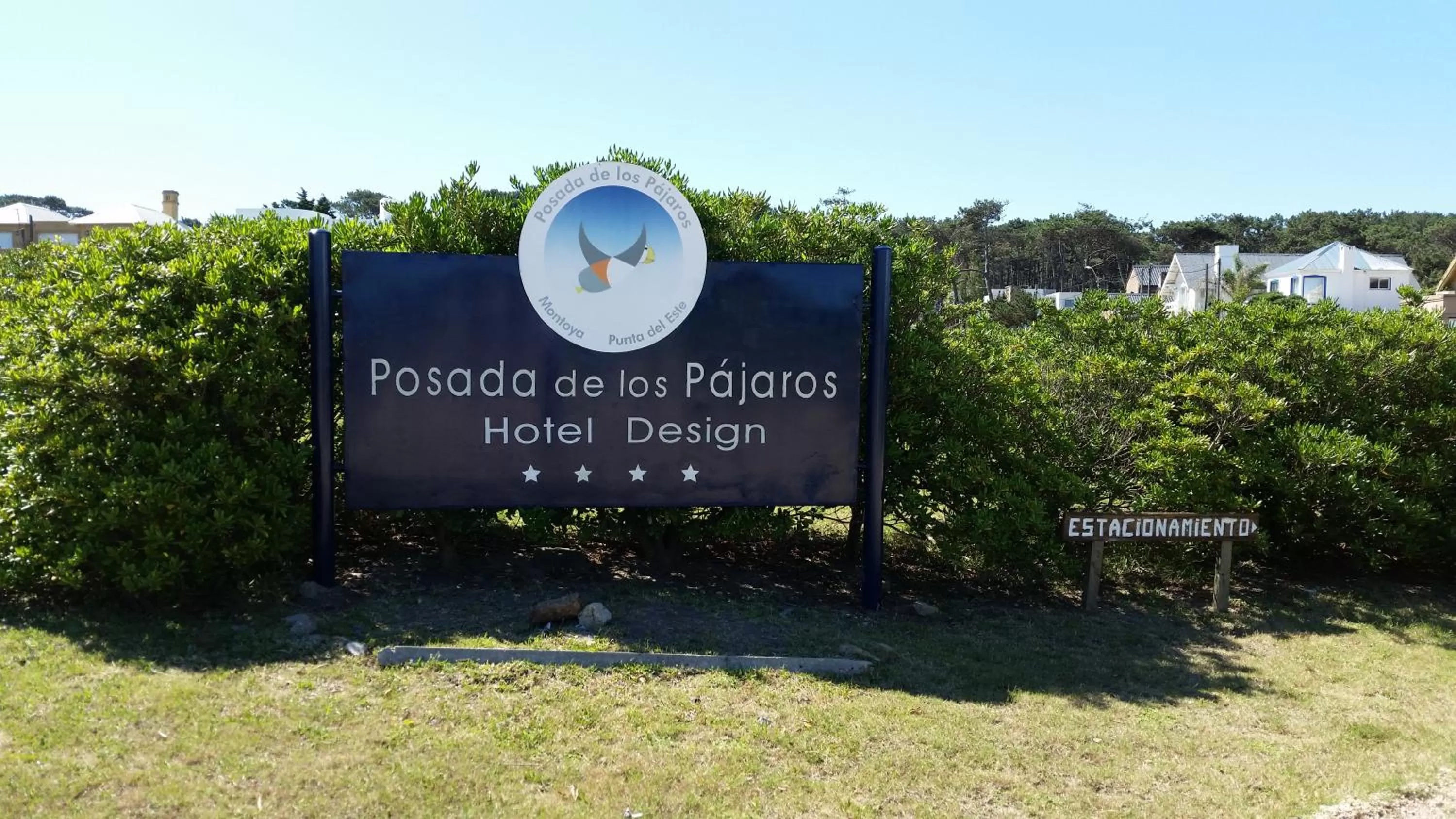 Property logo or sign in Posada de los Pajaros