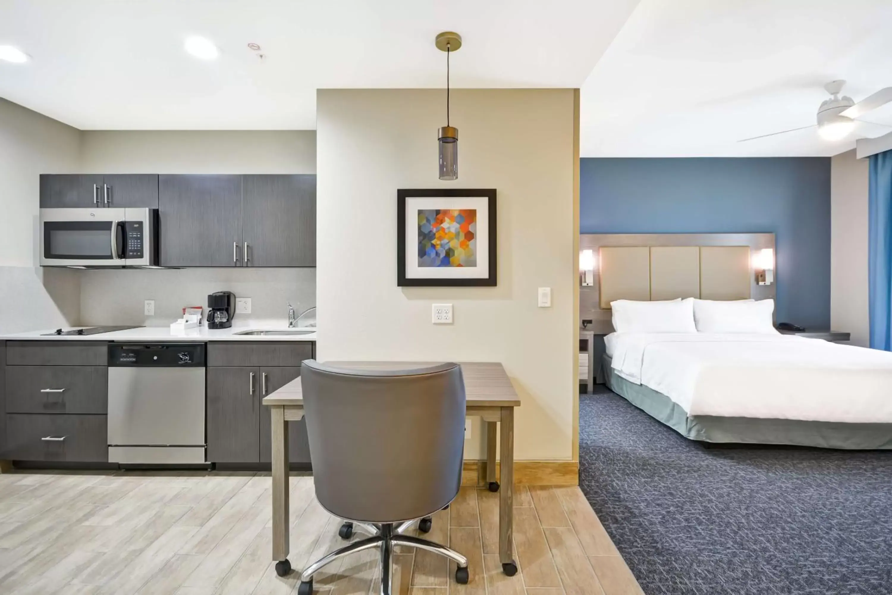 Bedroom, Kitchen/Kitchenette in Homewood Suites by Hilton Orlando Theme Parks