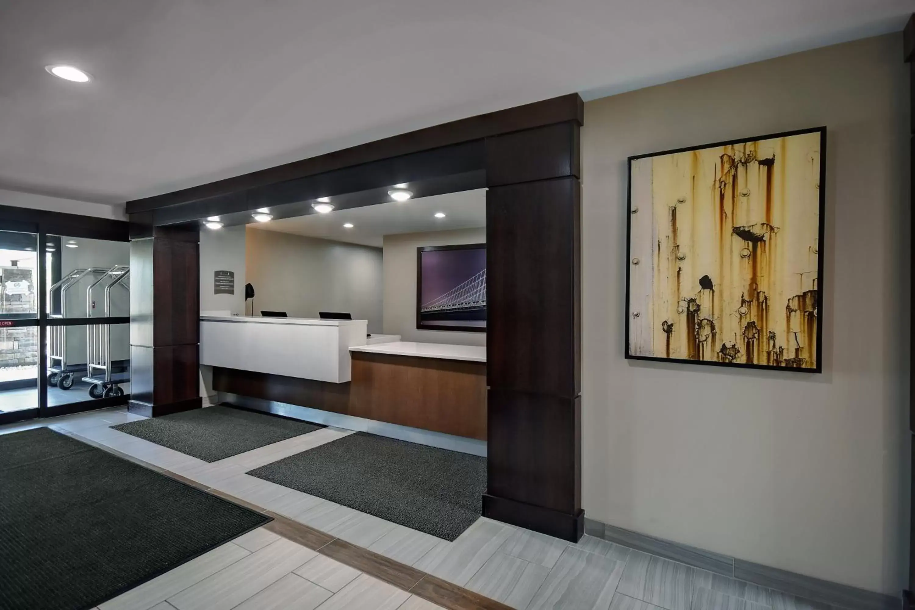 Property building, Lobby/Reception in Staybridge Suites - Holland, an IHG Hotel