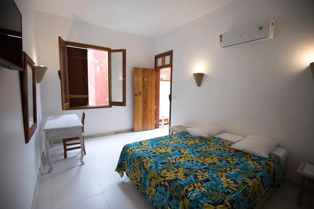 Bed in Pousada Jataí