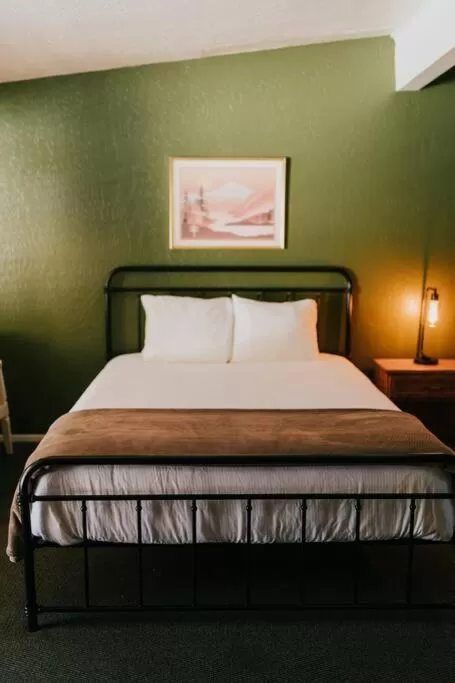 Bed in The Long Barn Lodge