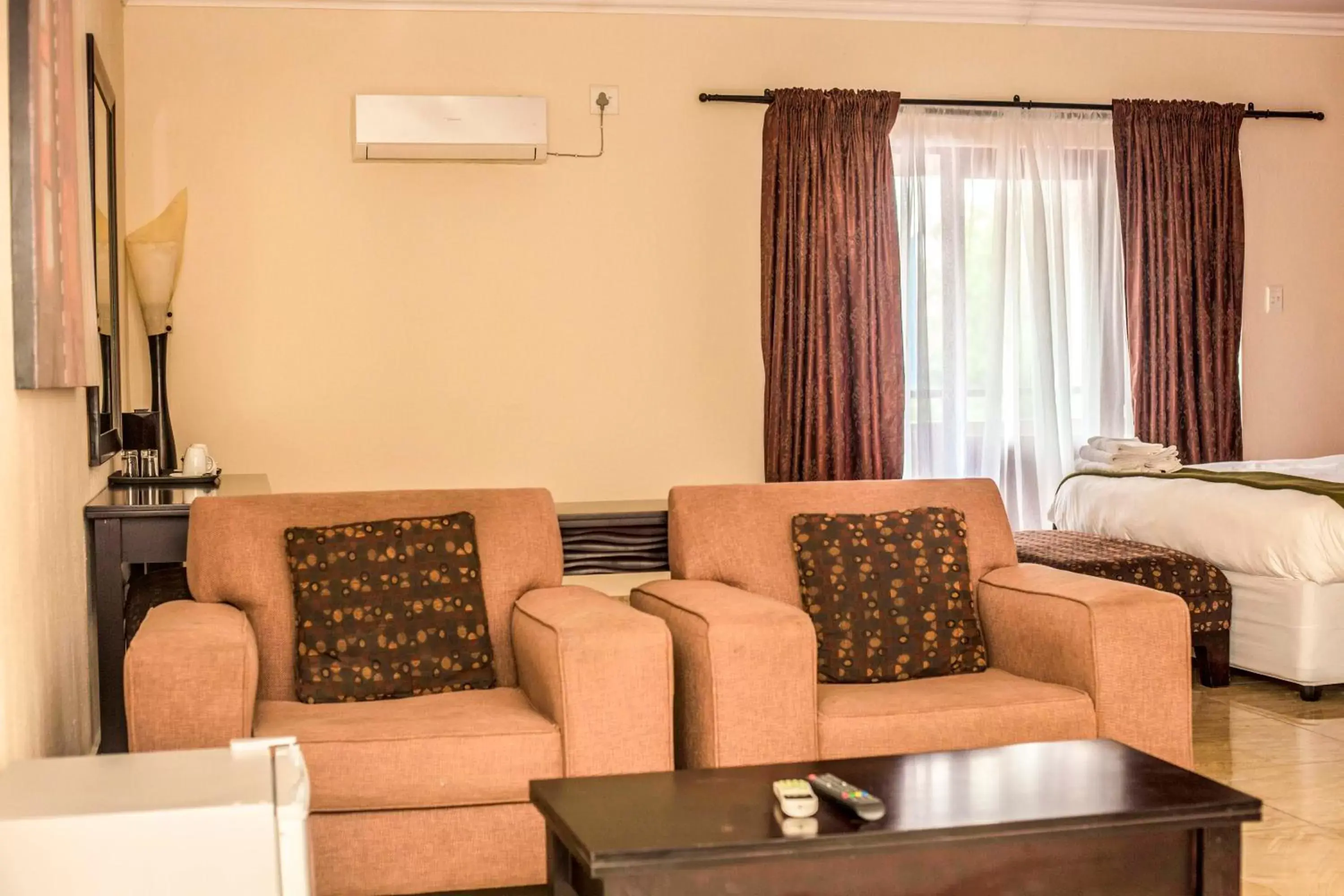 air conditioner, Seating Area in Coyotes Hotel & Conference Centre