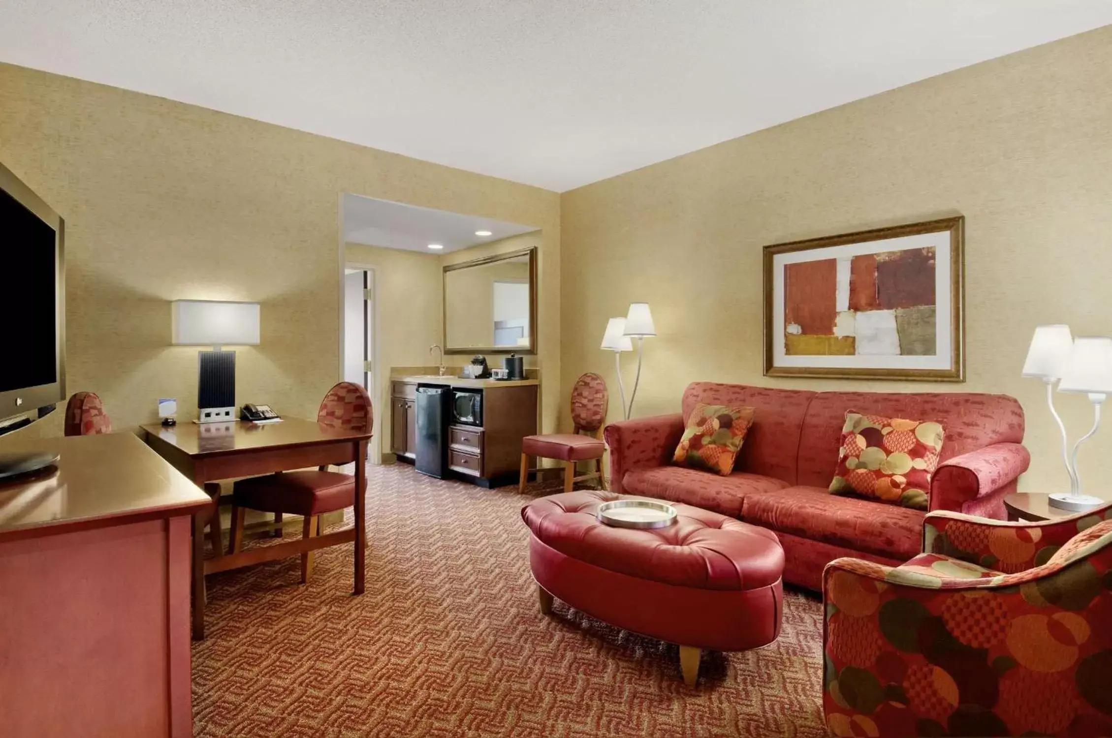 Bed, Seating Area in Embassy Suites by Hilton Charlotte Concord Golf Resort & Spa