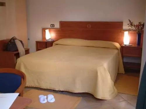 Bed in Caravaggio Hotel