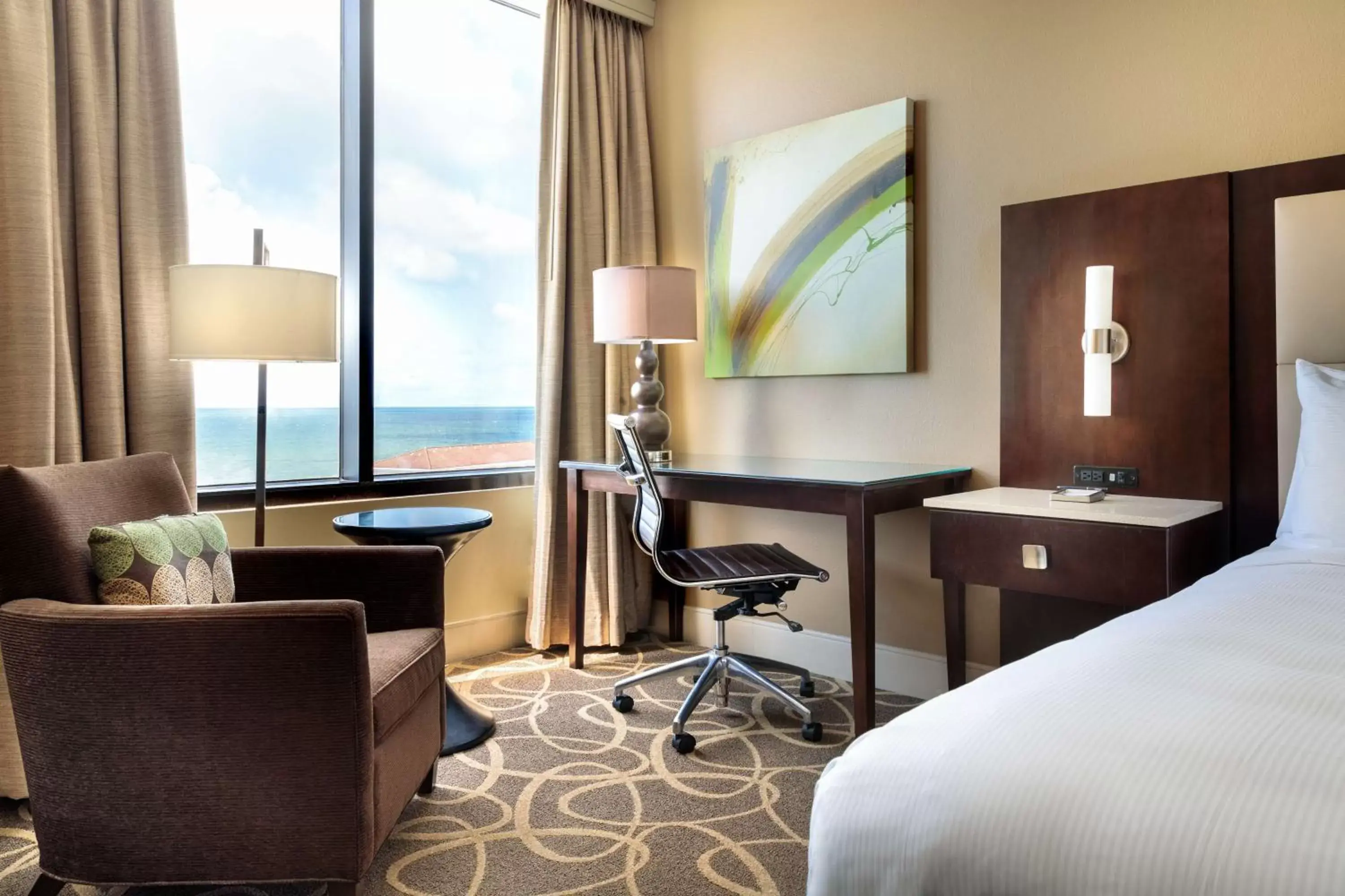 Bed, Seating Area in Hilton Galveston Island Resort