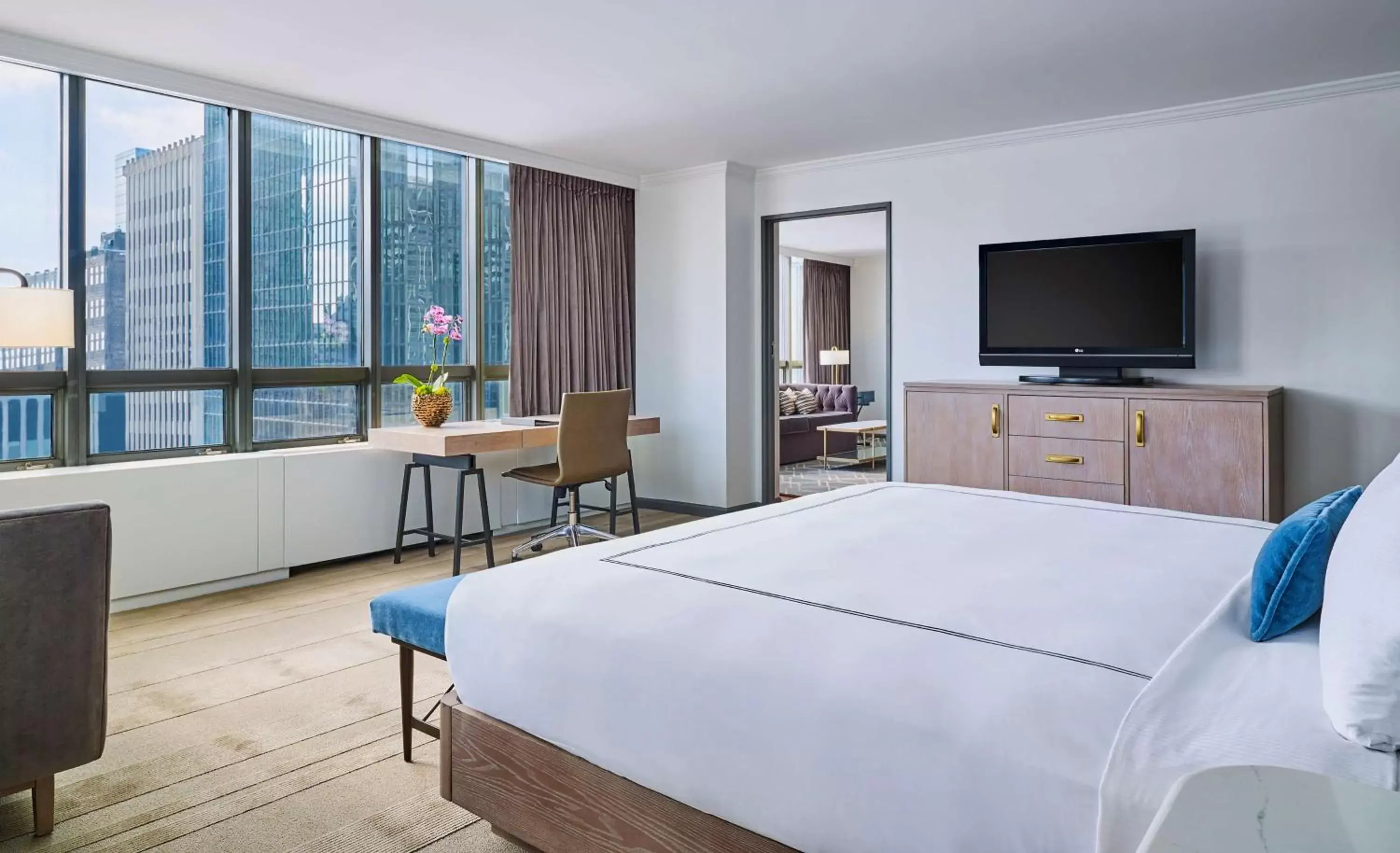 Bedroom, TV/Entertainment Center in The Marquette Hotel, Curio Collection by Hilton