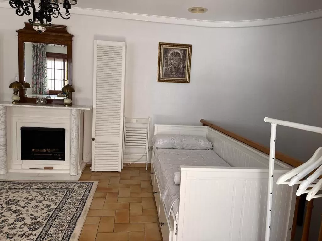 Bed, Seating Area in Casa Veronica