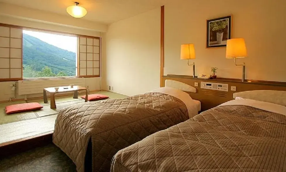 Bathroom, Bed in Madarao Kogen Hotel