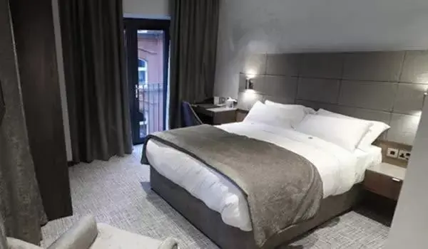 Bed in Ten Square Hotel