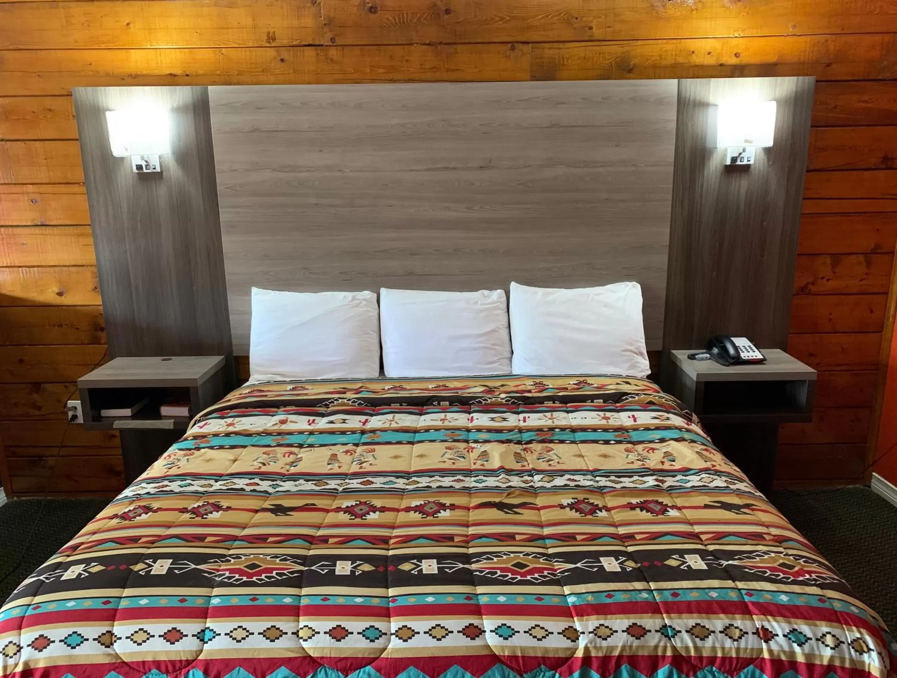 Bed in Log Cabin Inn