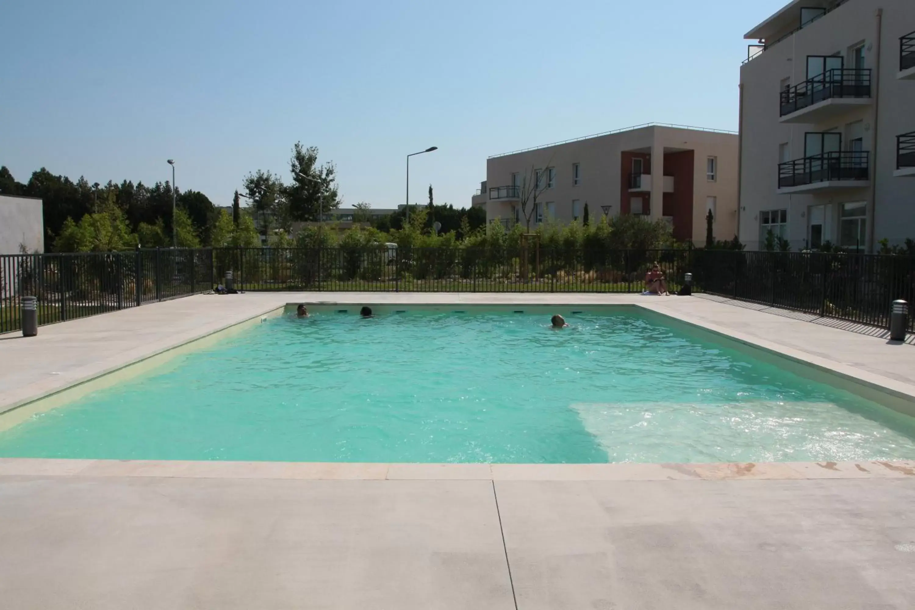 Swimming pool, Property Building in KOSY Appart'Hôtels - Campus Del Sol Esplanade