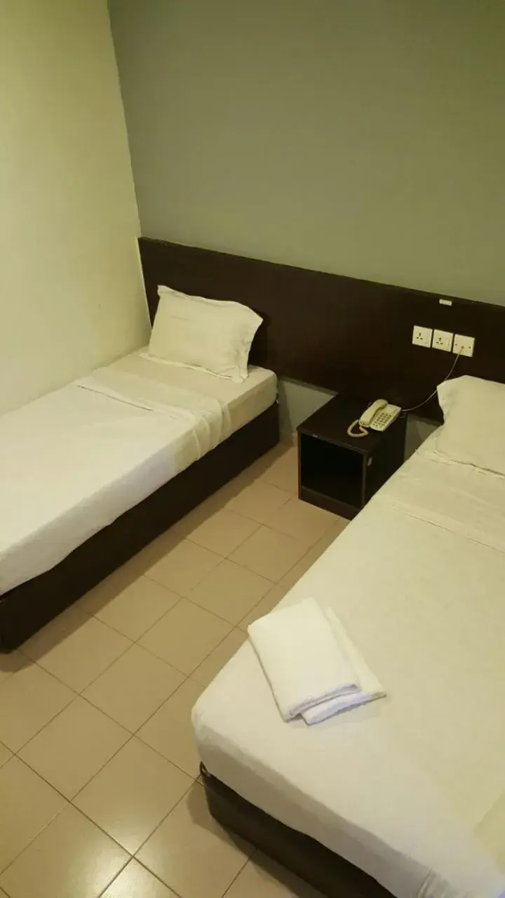 Bed in Tiong Nam Hotel