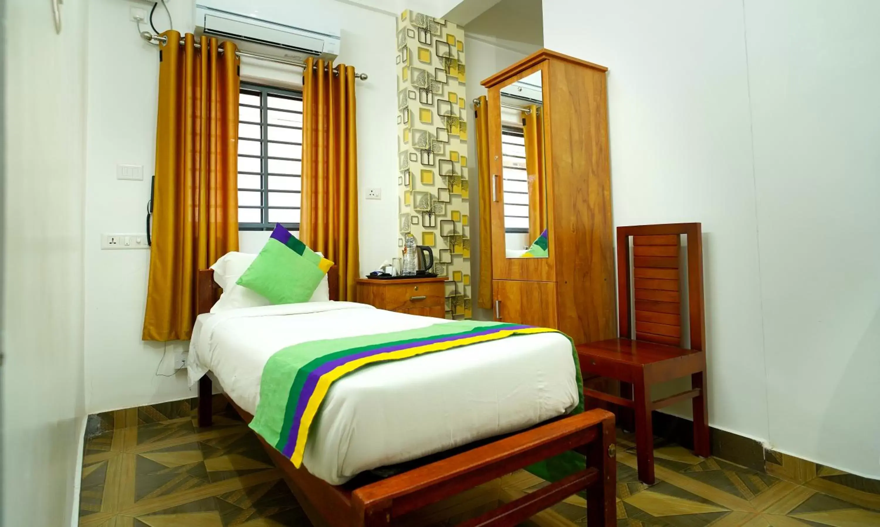 Bed in Treebo Trend Nirupama Apartment