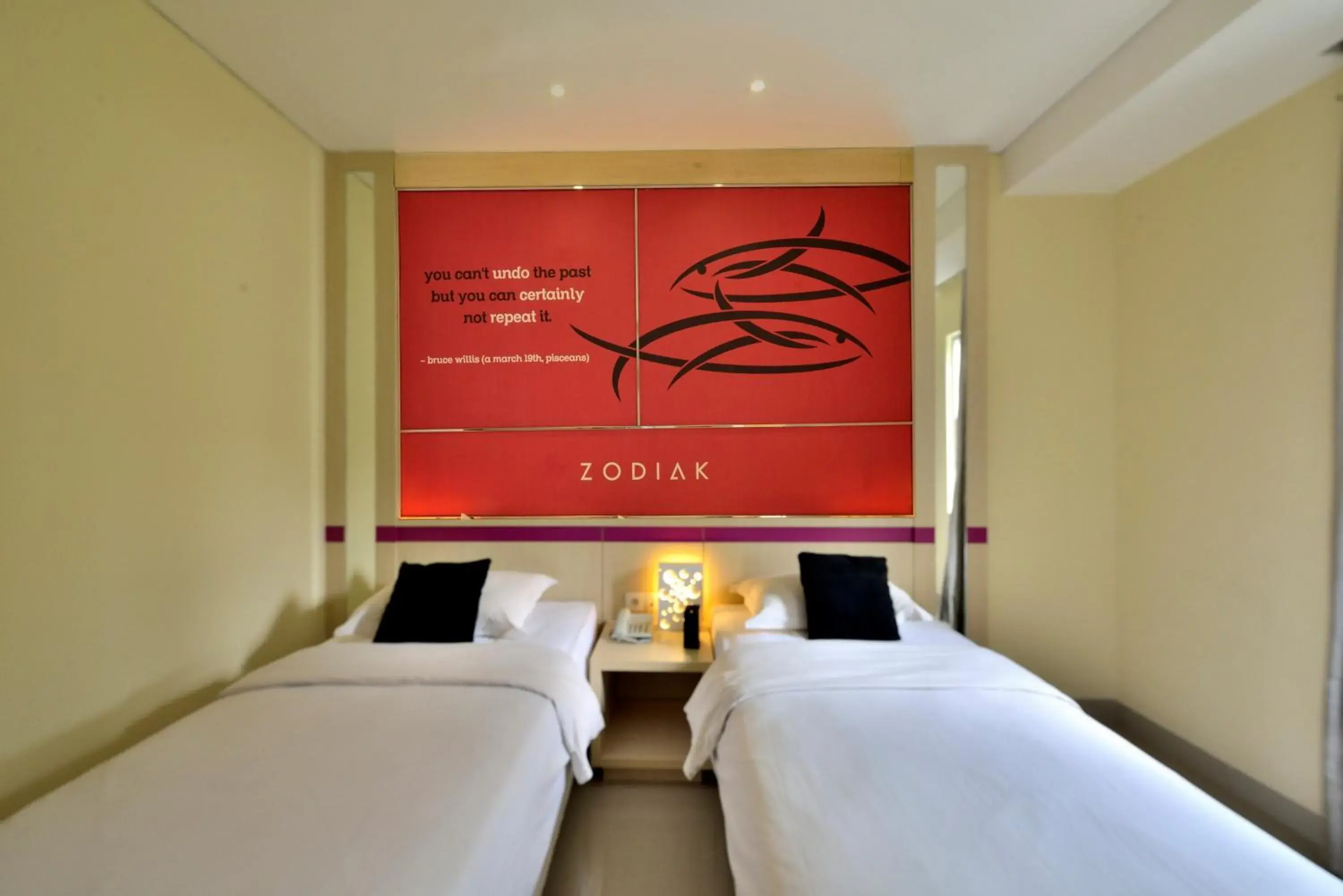 Bed in Zodiak Kebon Kawung by KAGUM Hotels