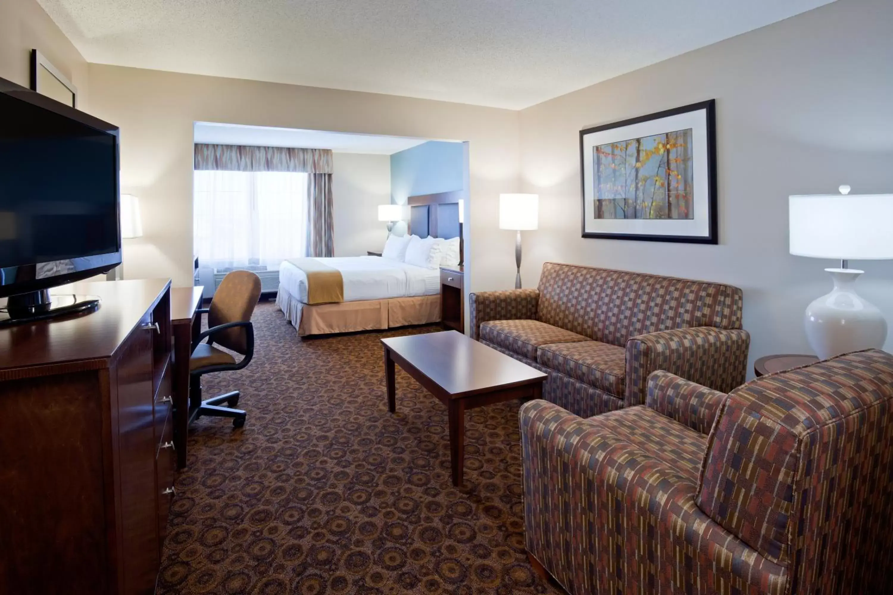 Photo of the whole room, TV/Entertainment Center in Holiday Inn Express and Suites St. Cloud, an IHG Hotel