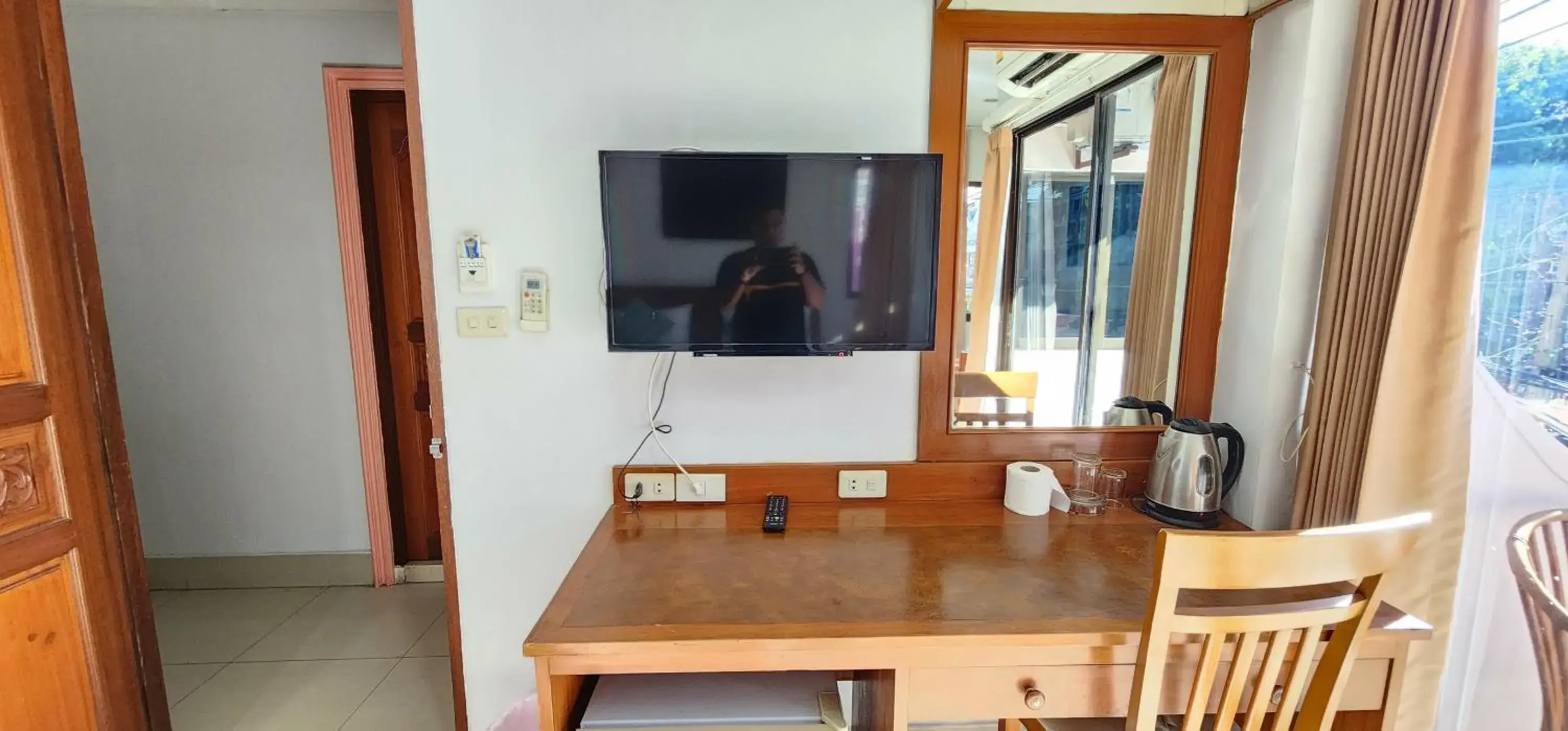 TV and multimedia, TV/Entertainment Center in Royal Swiss Guest House