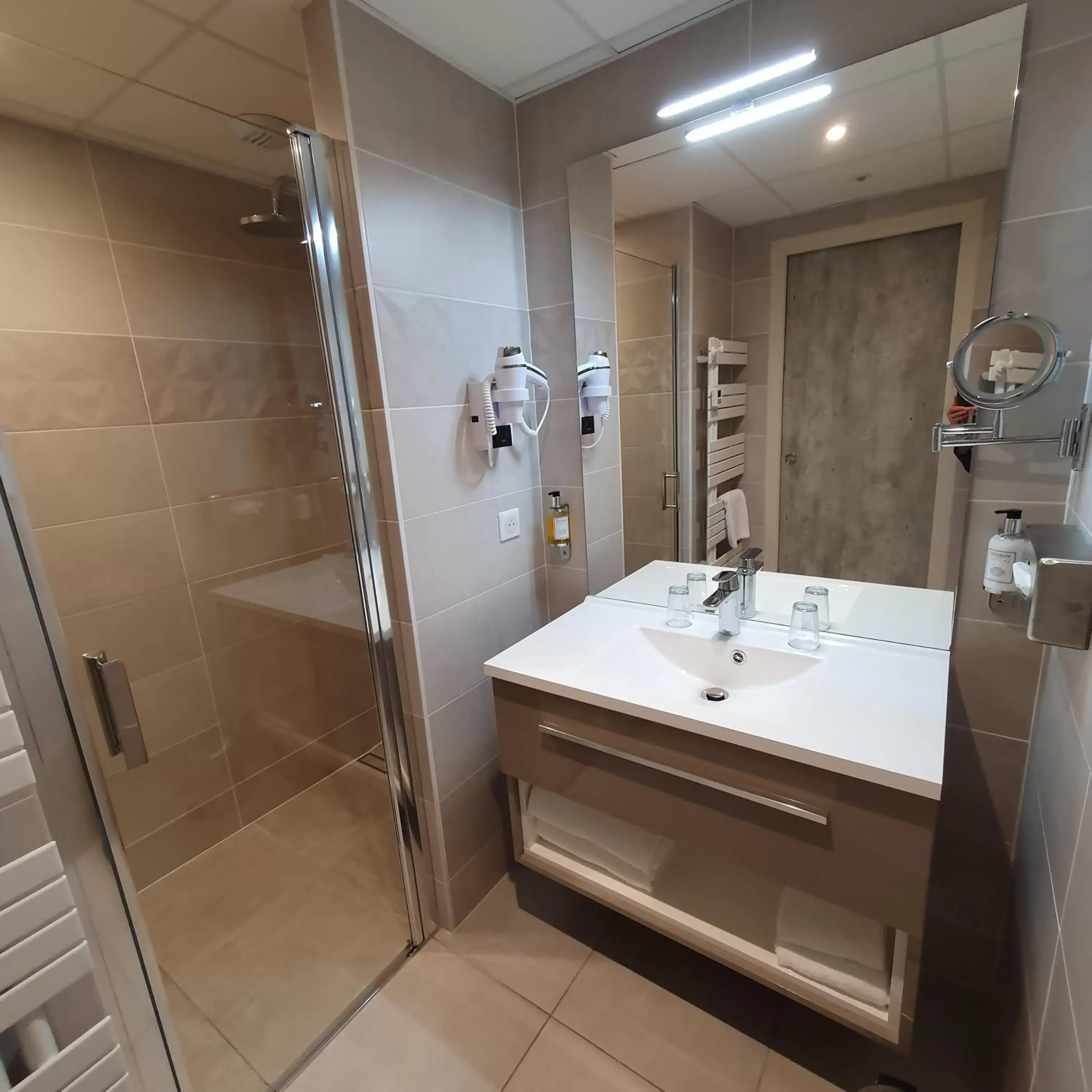 Property building, Bathroom in Logis Hotel La Closerie