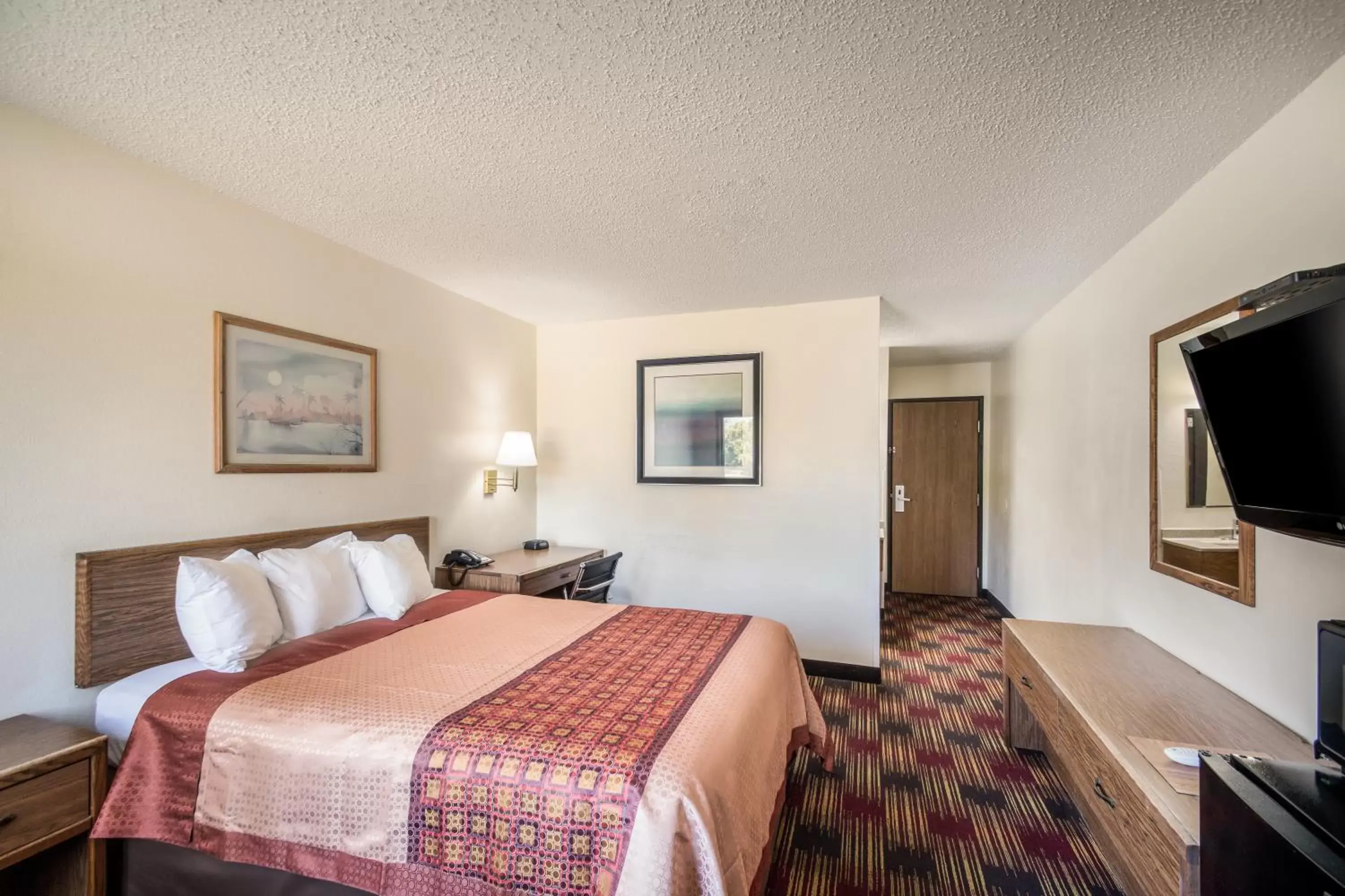 Bed in Americas Best Value Inn & Suites Harrisonville