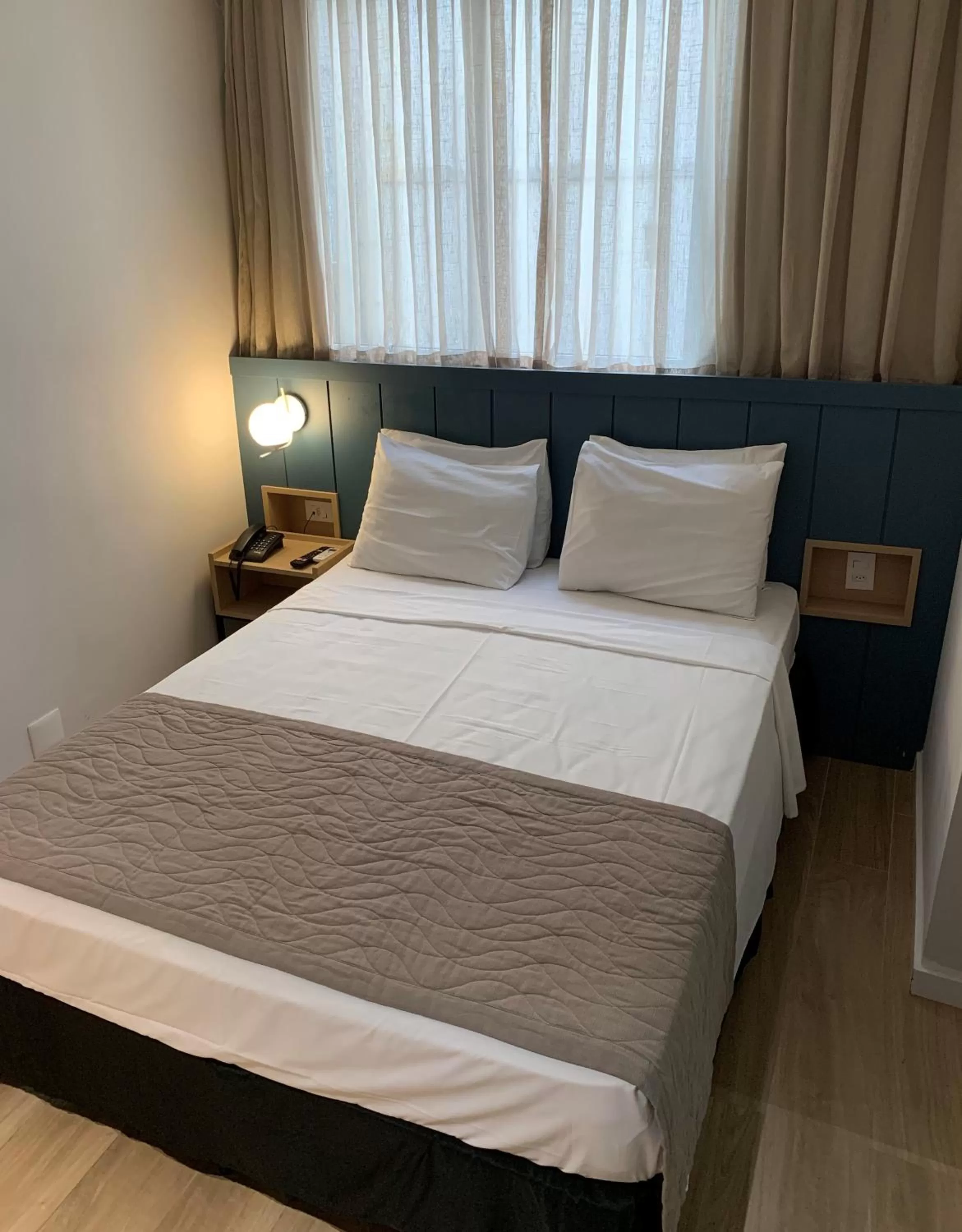 Bed in Regency Copacabana Hotel