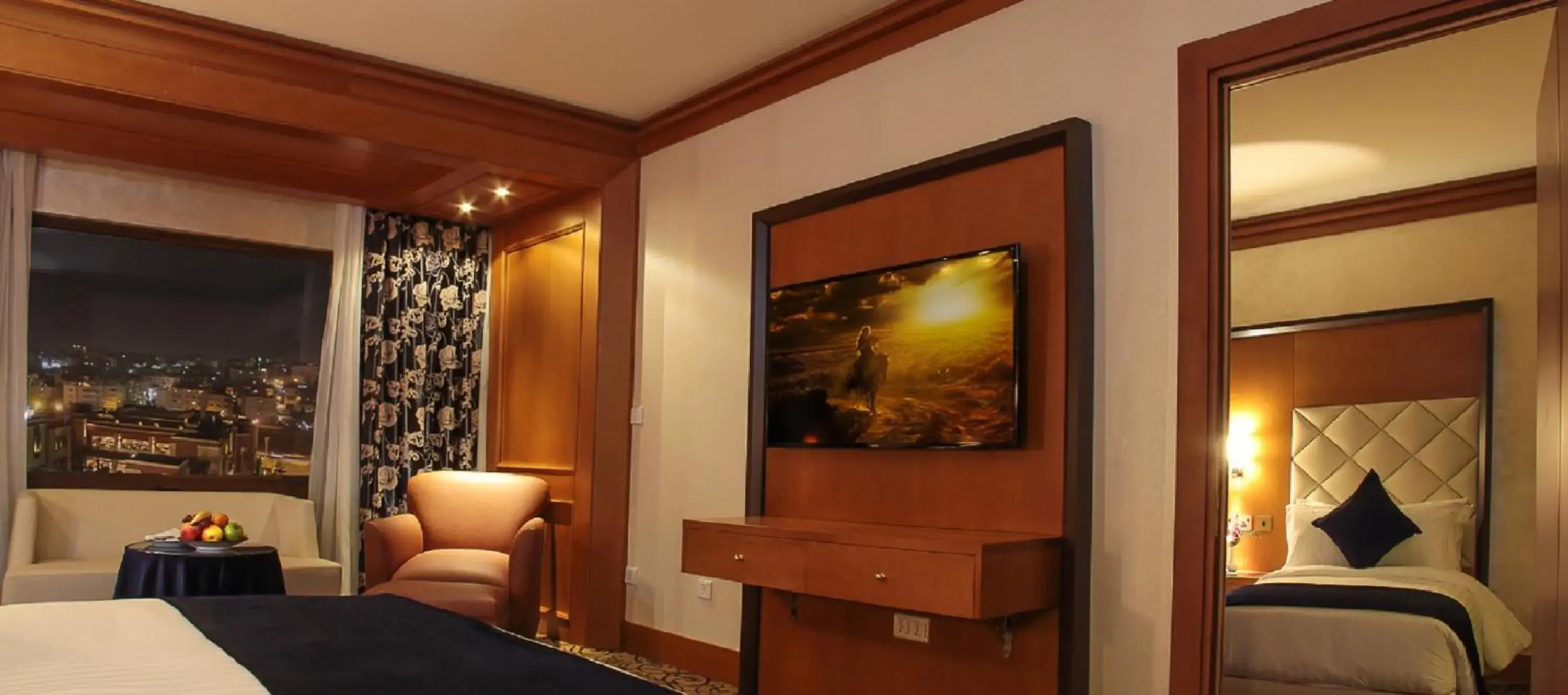 Bedroom, TV/Entertainment Center in Thousand Nights Hotel