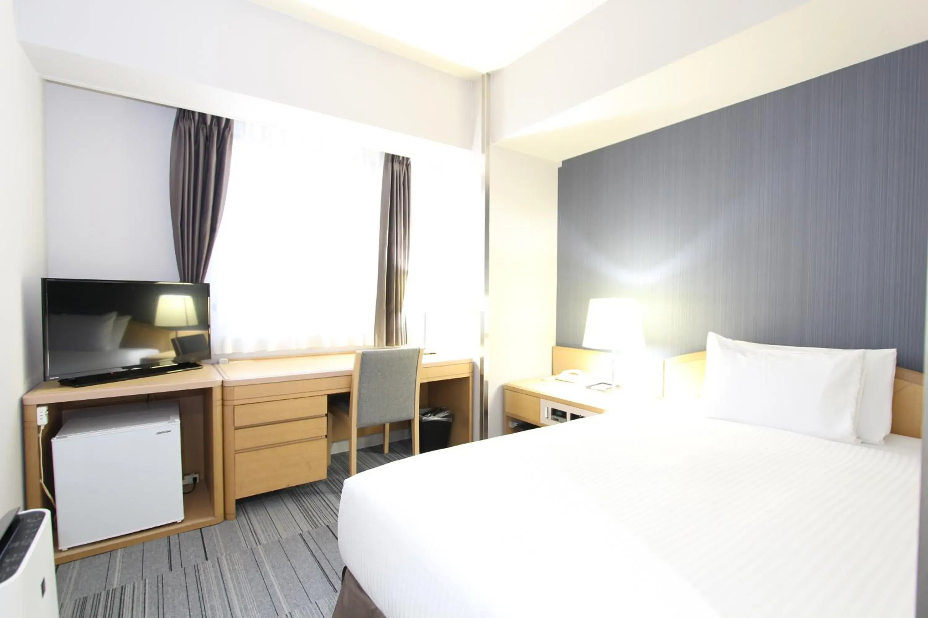 Bed in SureStay Plus Hotel by Best Western Shin-Osaka