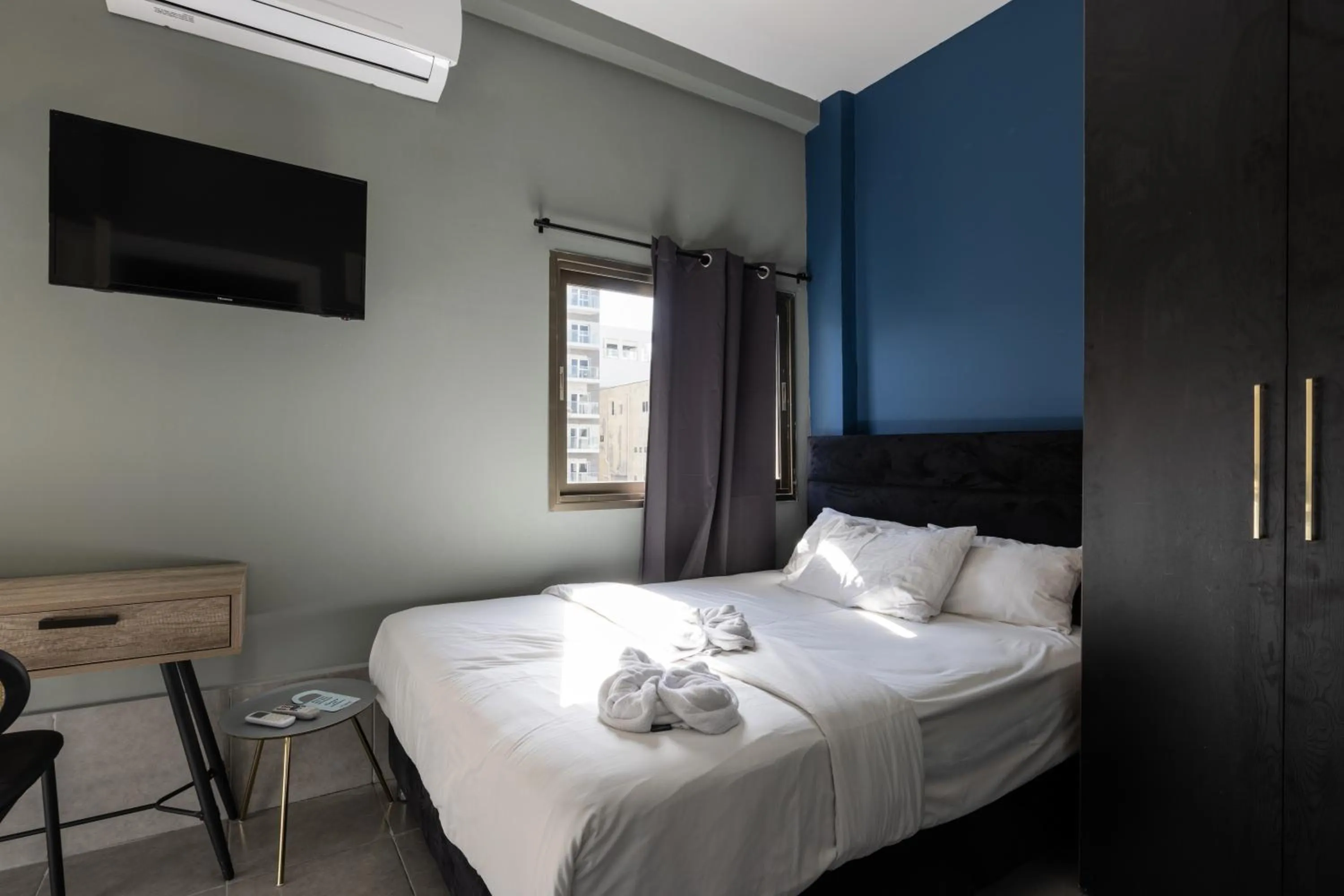 Photo of the whole room, Bed in Liber Tel Aviv Sea Shore Suites BY RAPHAEL HOTELS