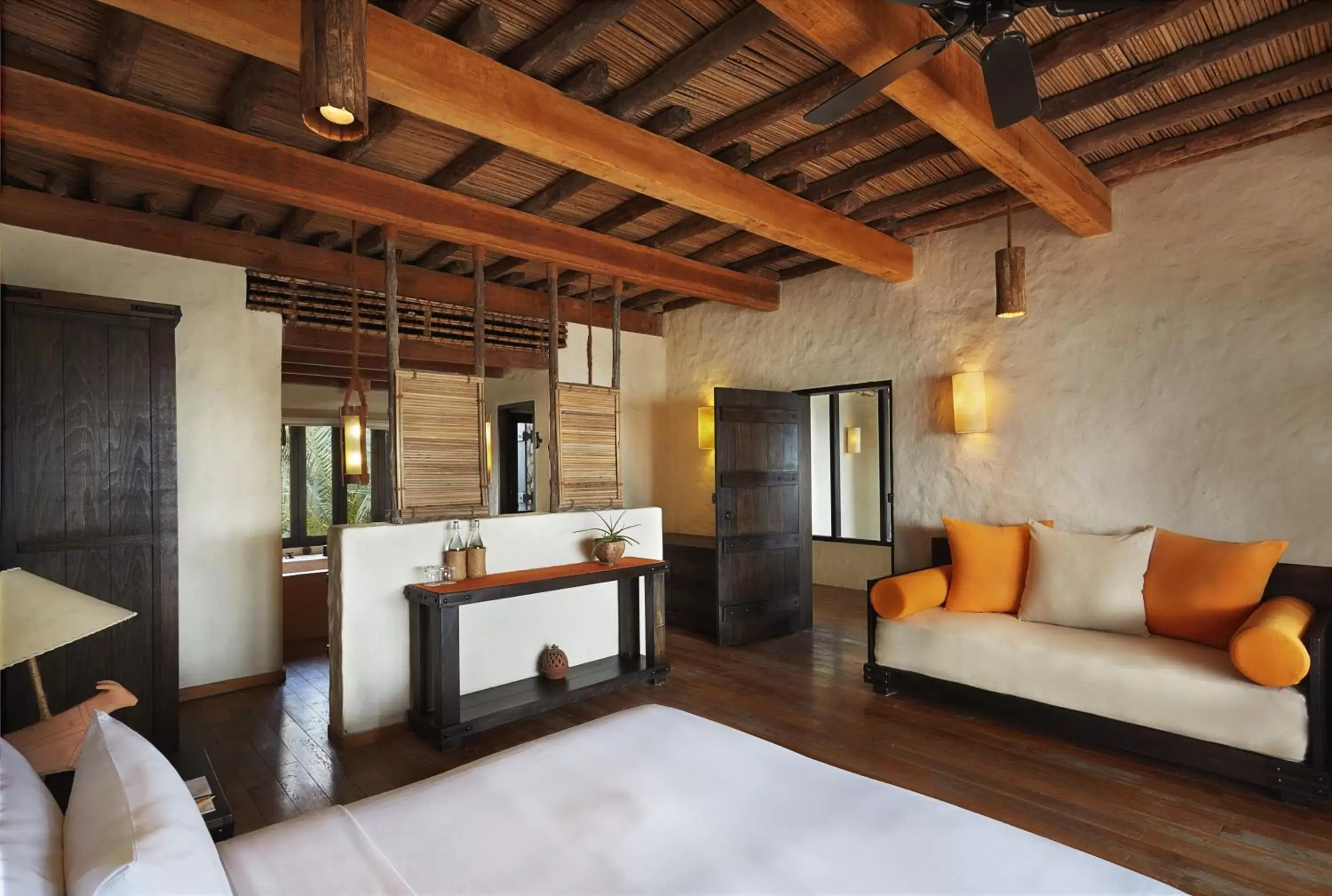 Bed, Seating Area in Six Senses Zighy Bay