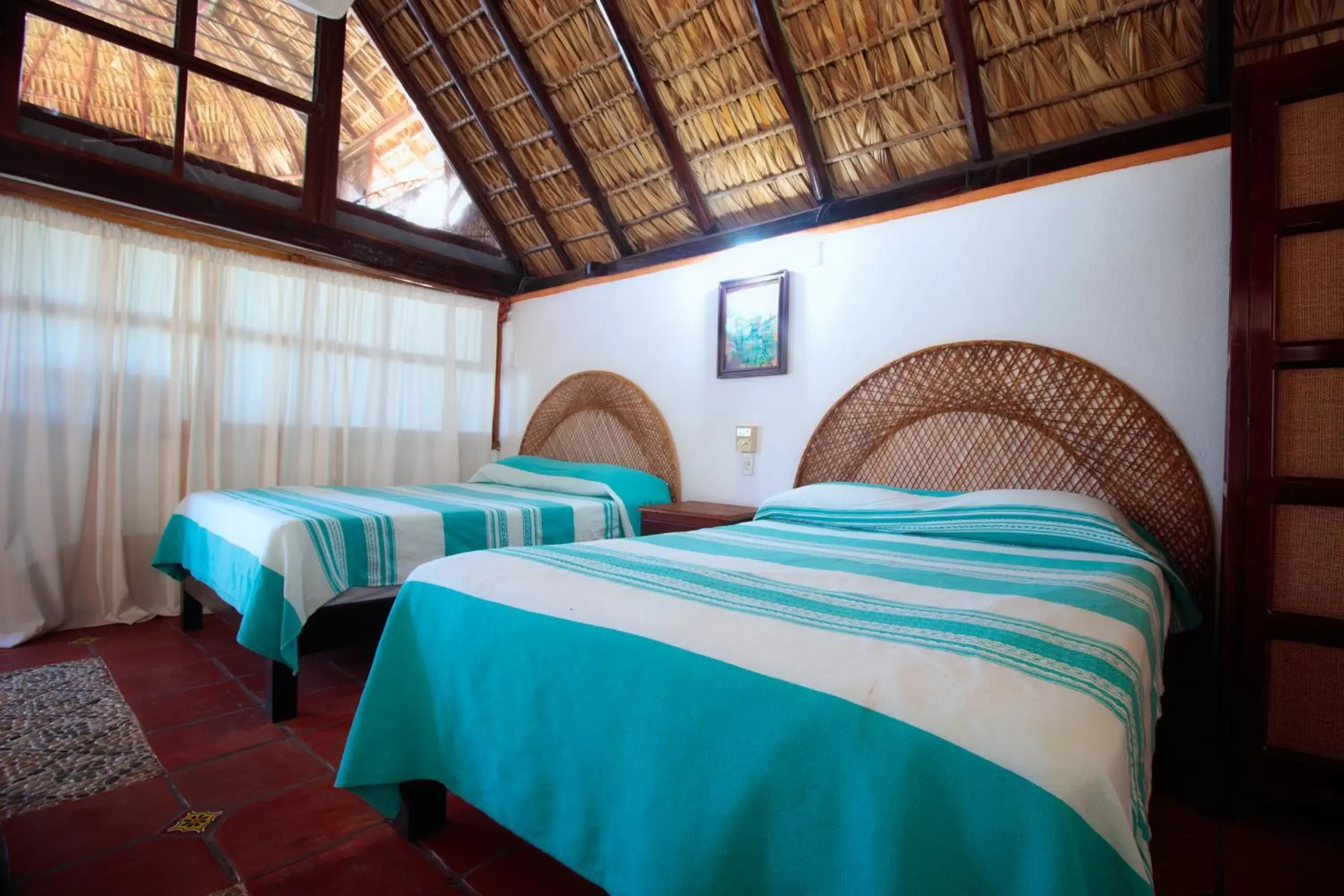 Deluxe Queen Room with Two Queen Beds in Hotel Bungalows Acuario