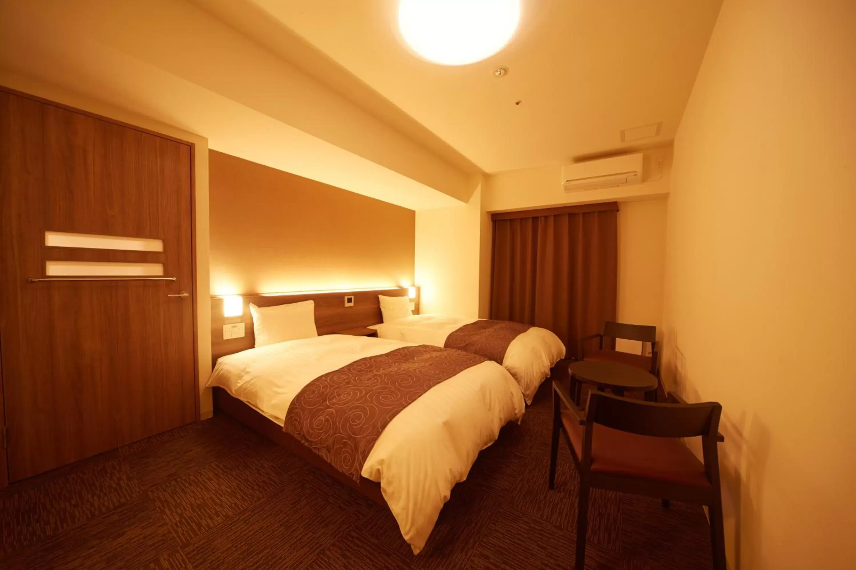 Bed in Dormy Inn Premium Nagoya Sakae