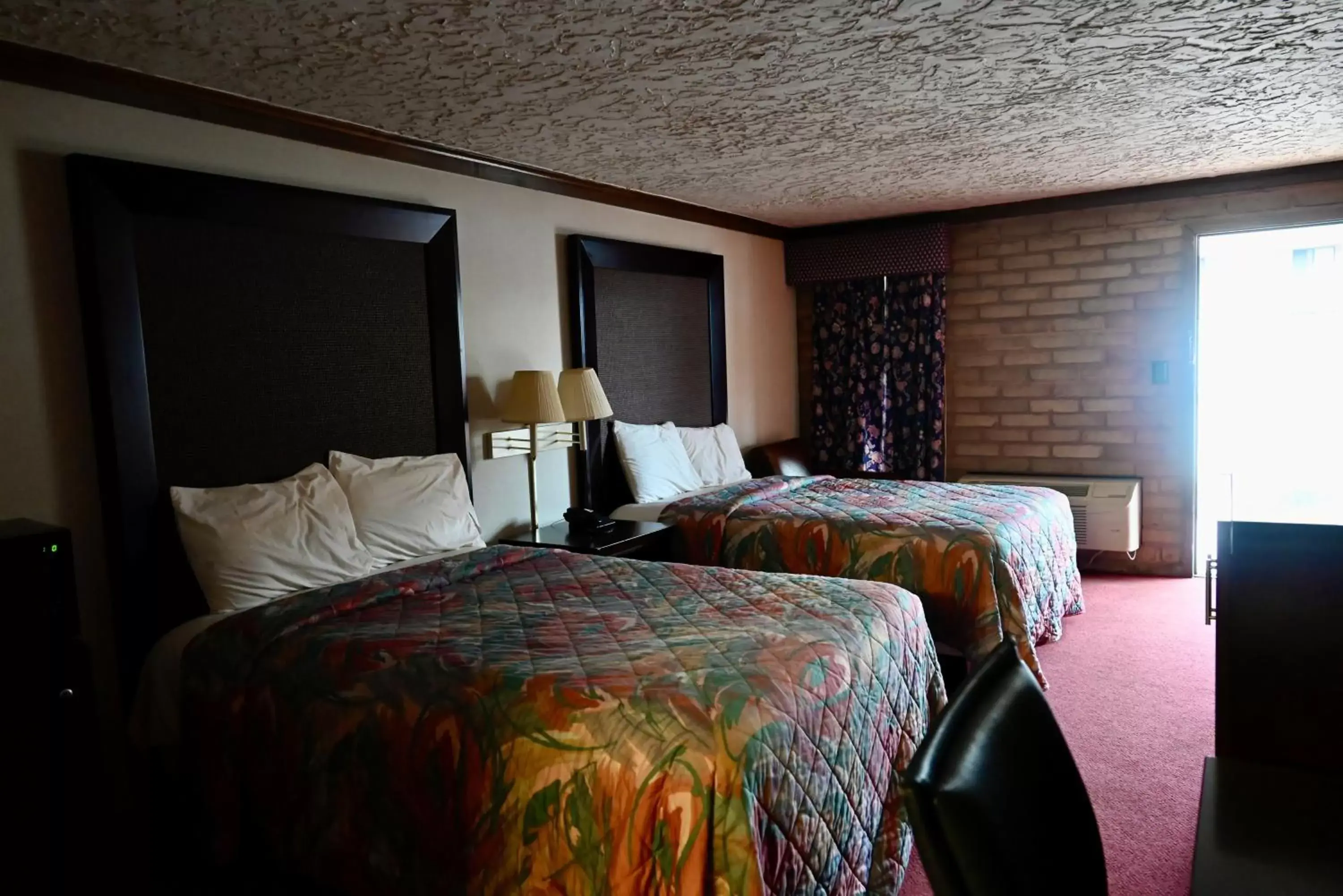 Bed in Rittiman Inn and Suites