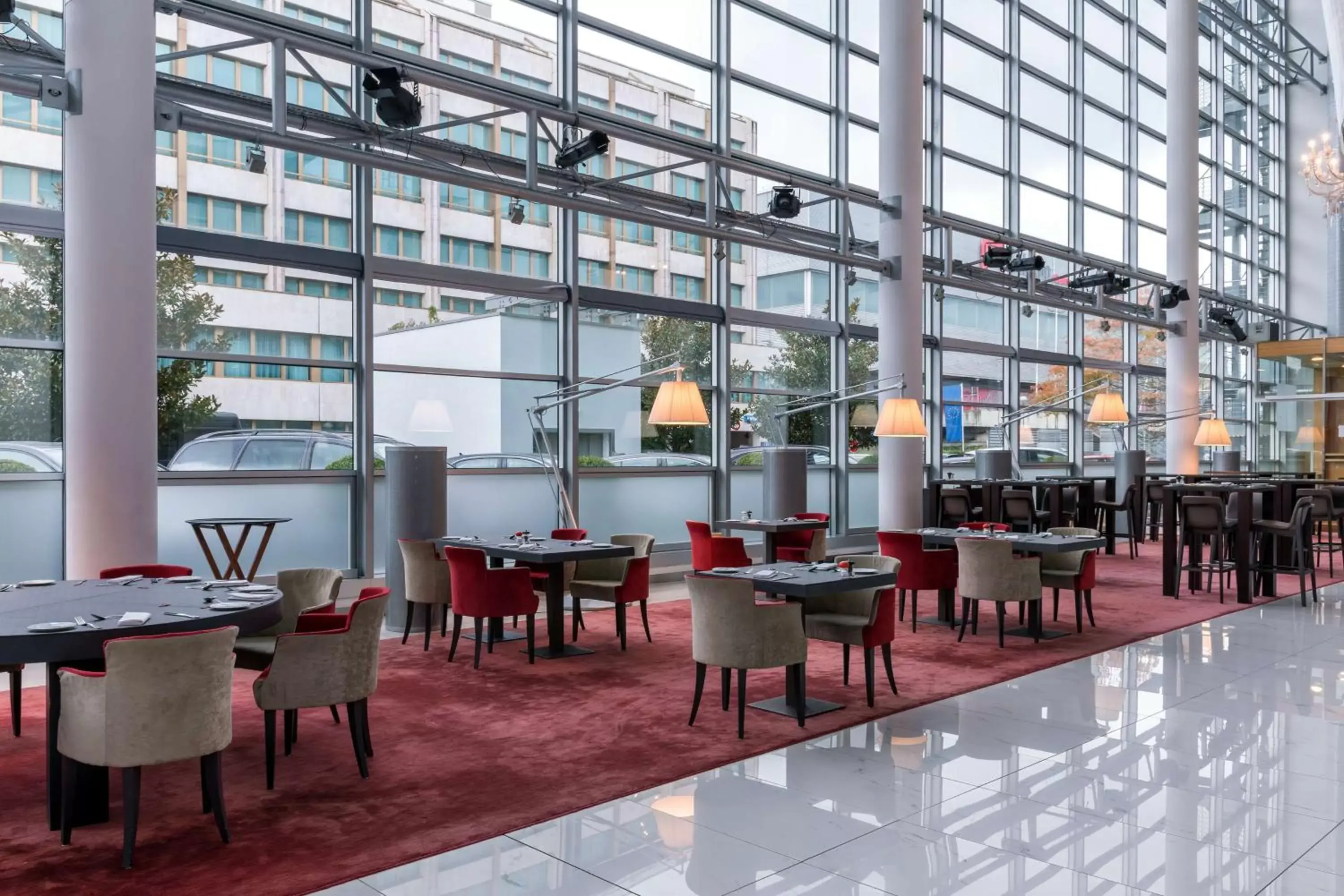 Lounge or bar in Hilton Geneva Hotel and Conference Centre Lounge or bar in Hilton Geneva Hotel and Conference Centre