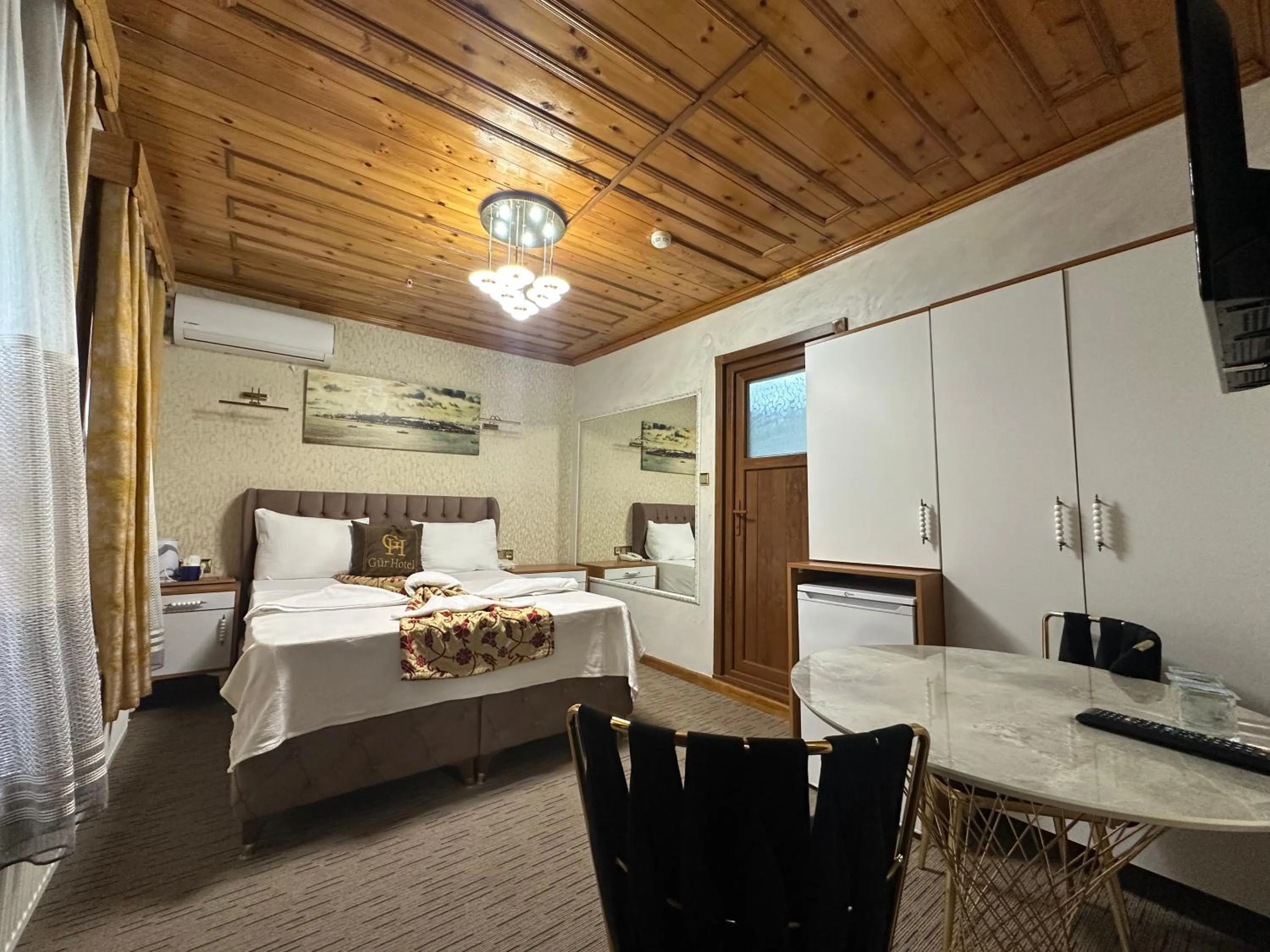 Bed in Royal Gur Hotel