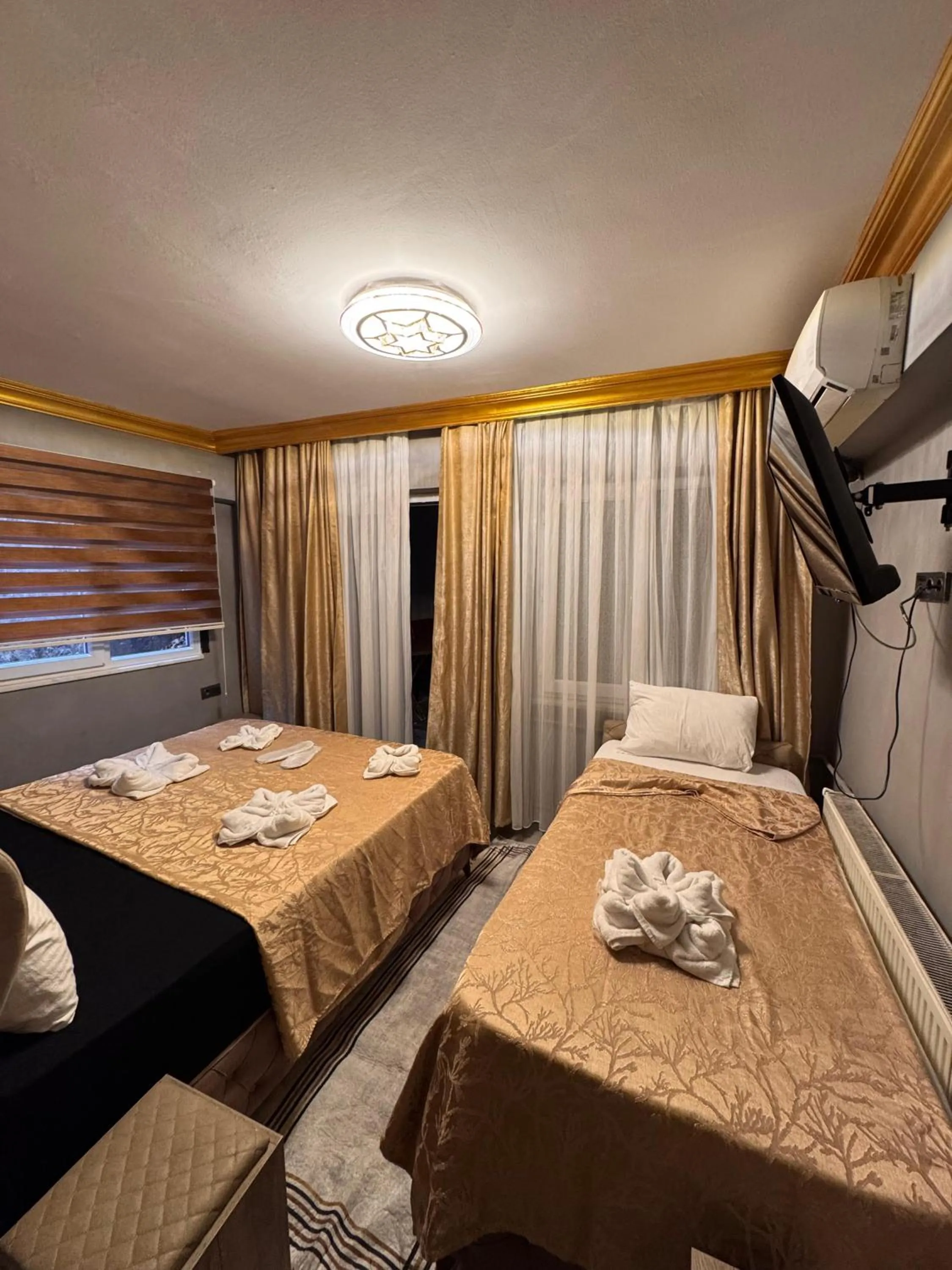 Bed in Royal Gur Hotel