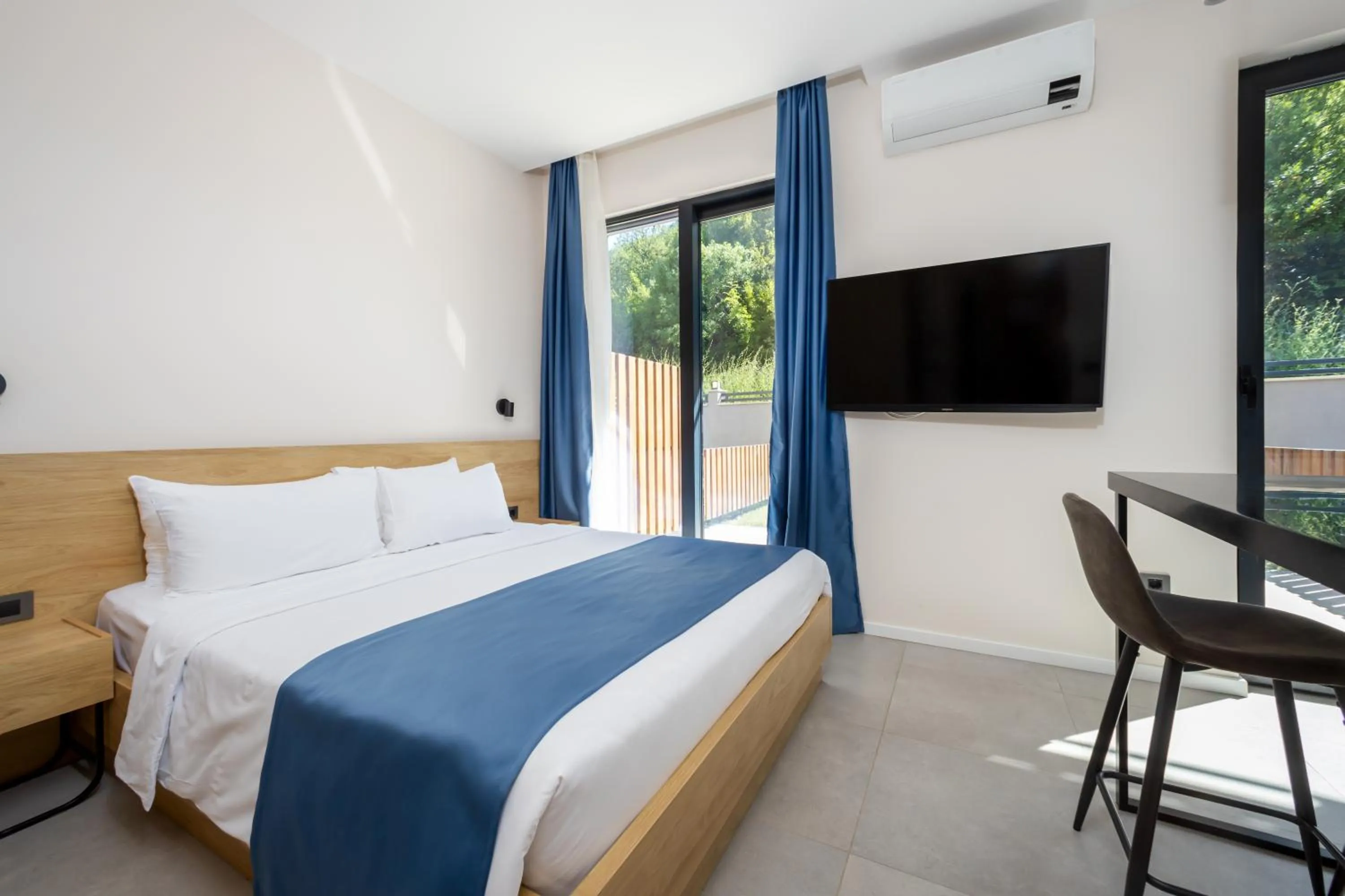 Bed in Royal Blue Resort & Residences