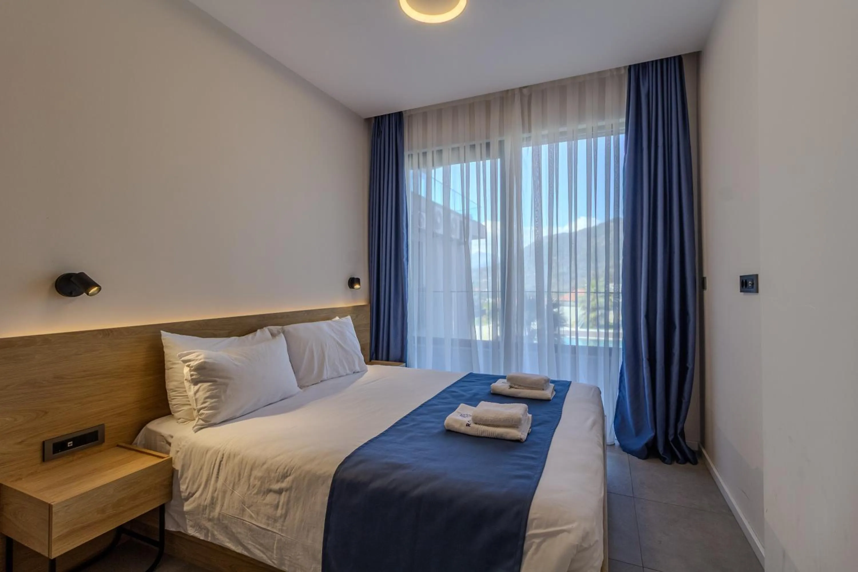 Bed in Royal Blue Resort & Residences