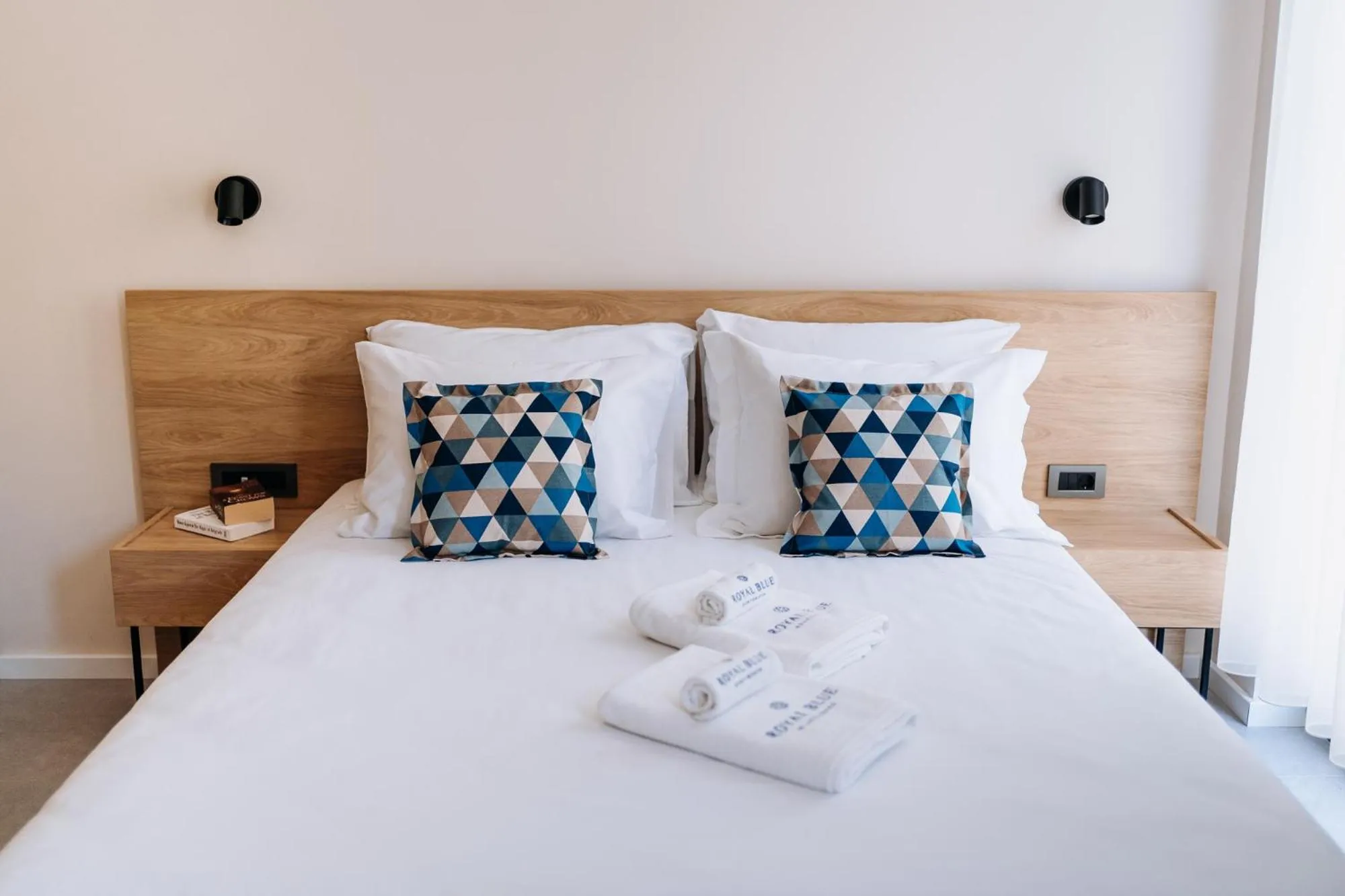 Bed in Royal Blue Resort & Residences