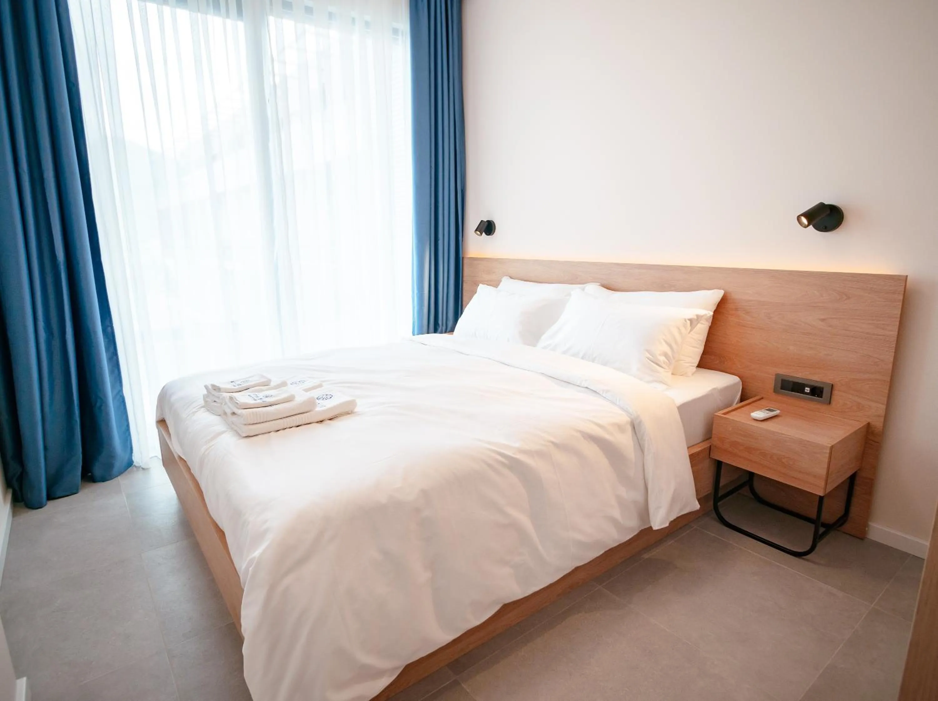 Bed in Royal Blue Resort & Residences