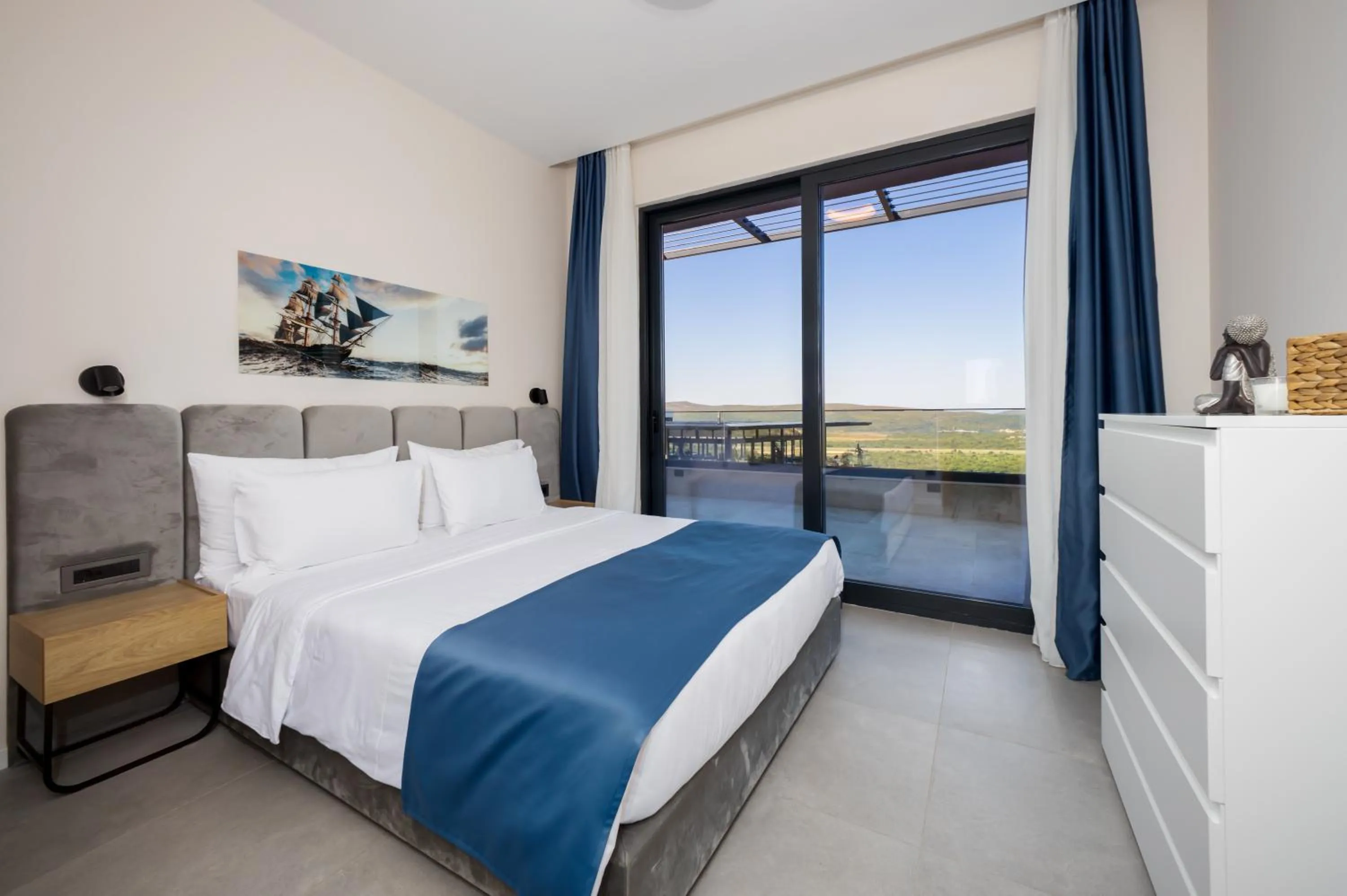 Bed in Royal Blue Resort & Residences