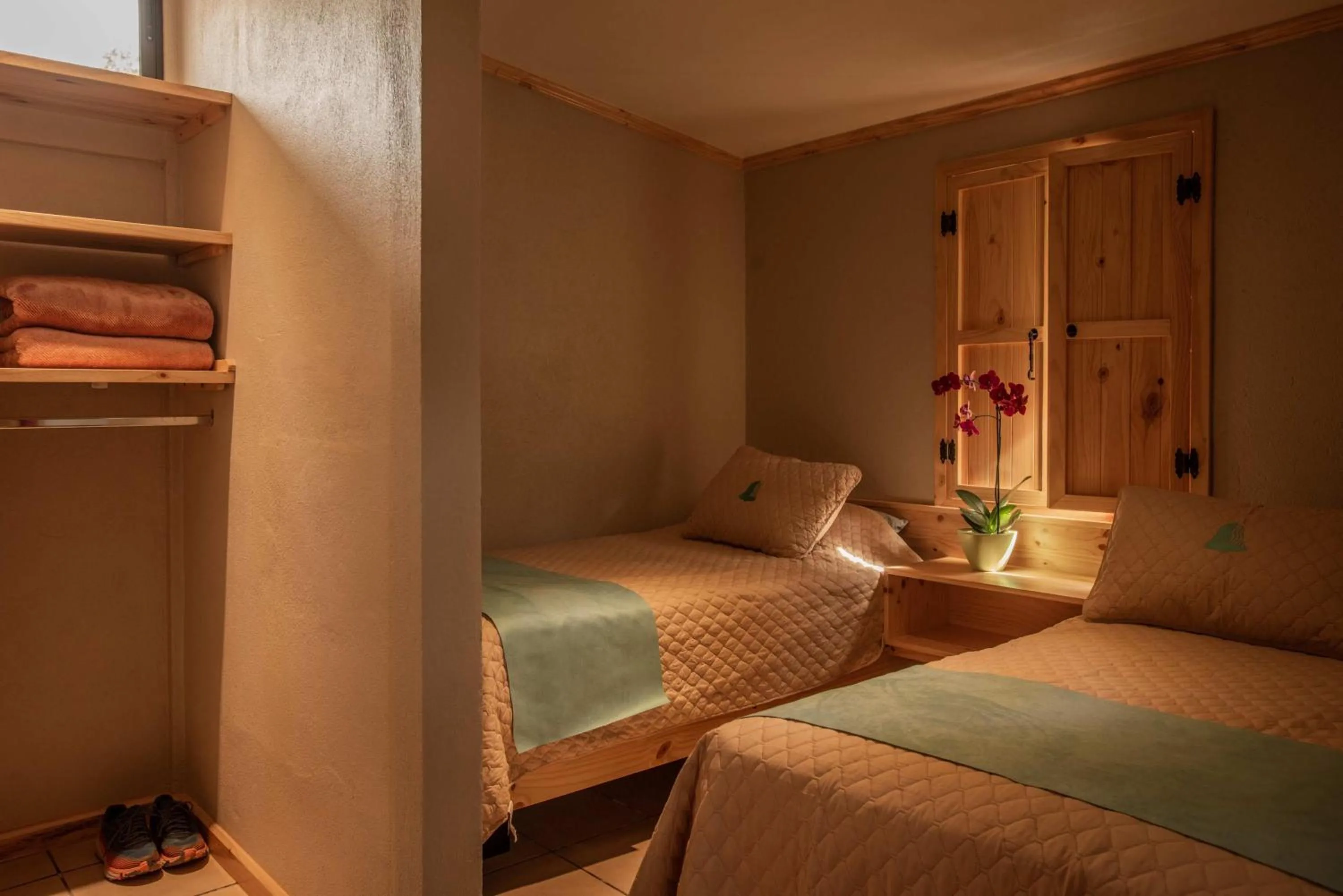 Text overlay, Bed in Coffee Pickers Village By Hacienda Orosi