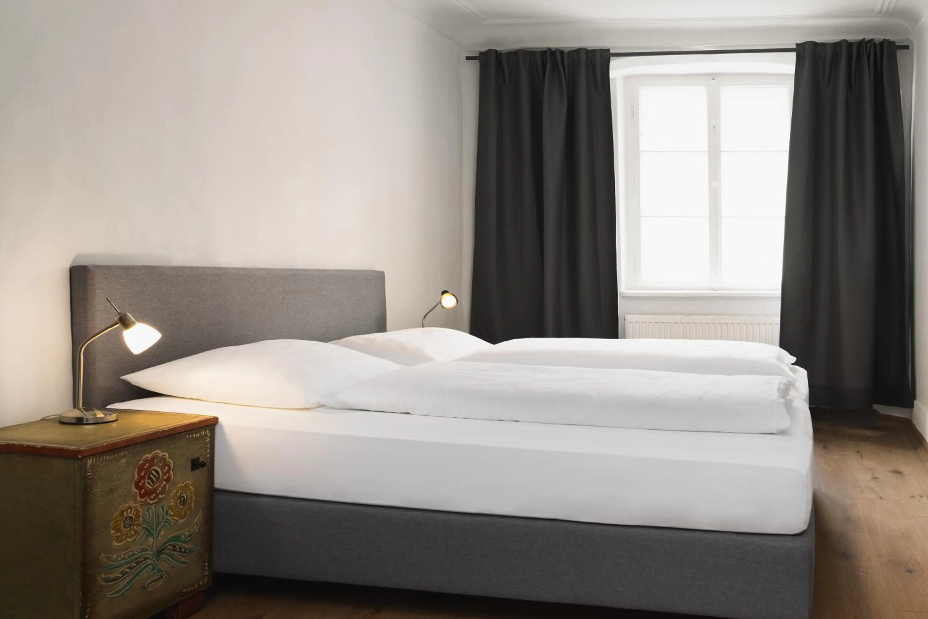 Bed in Apartments Golden Roof by Penz