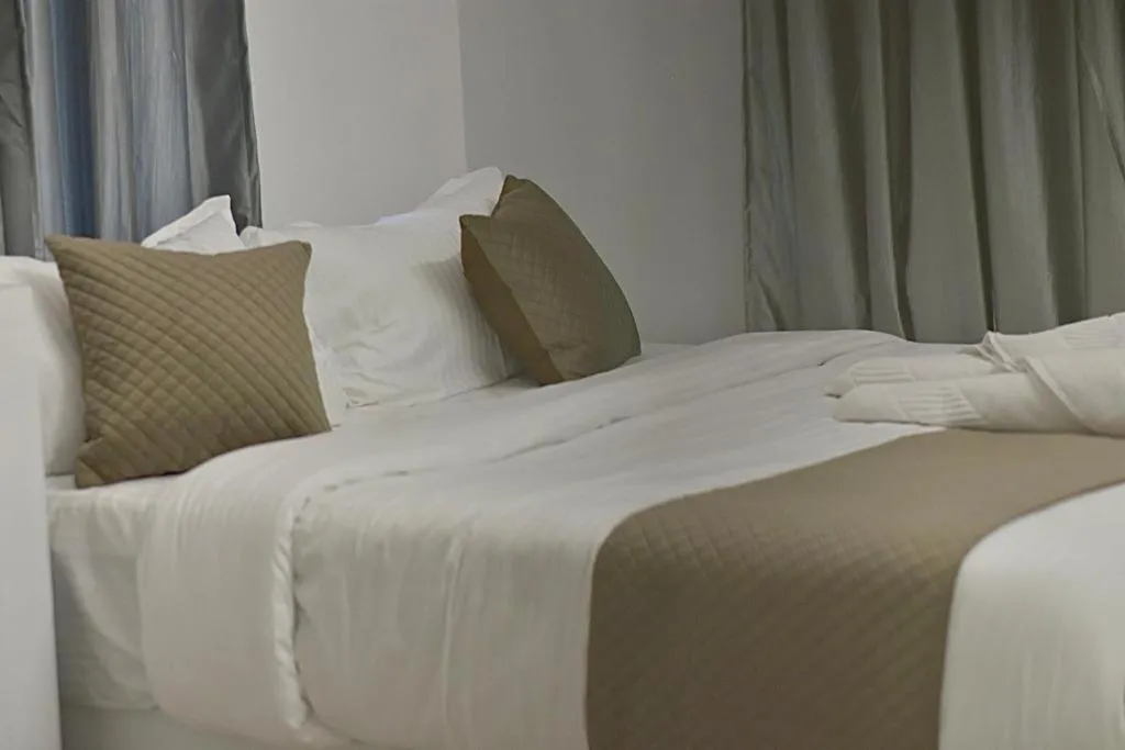 Bed in Wayanad Cliff Hotel Apartments