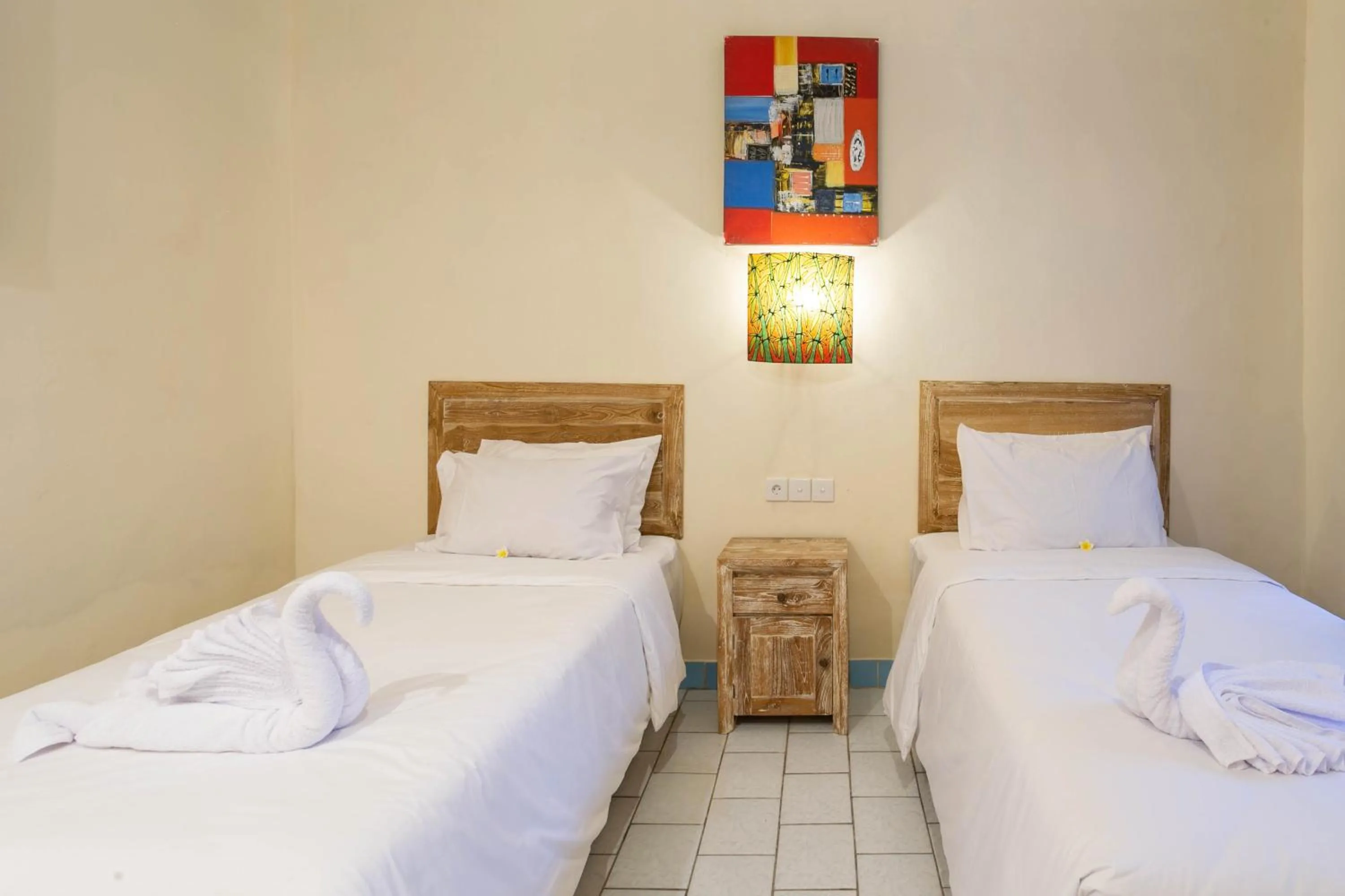 Bed in Utama Villas Beach Front Candidasa