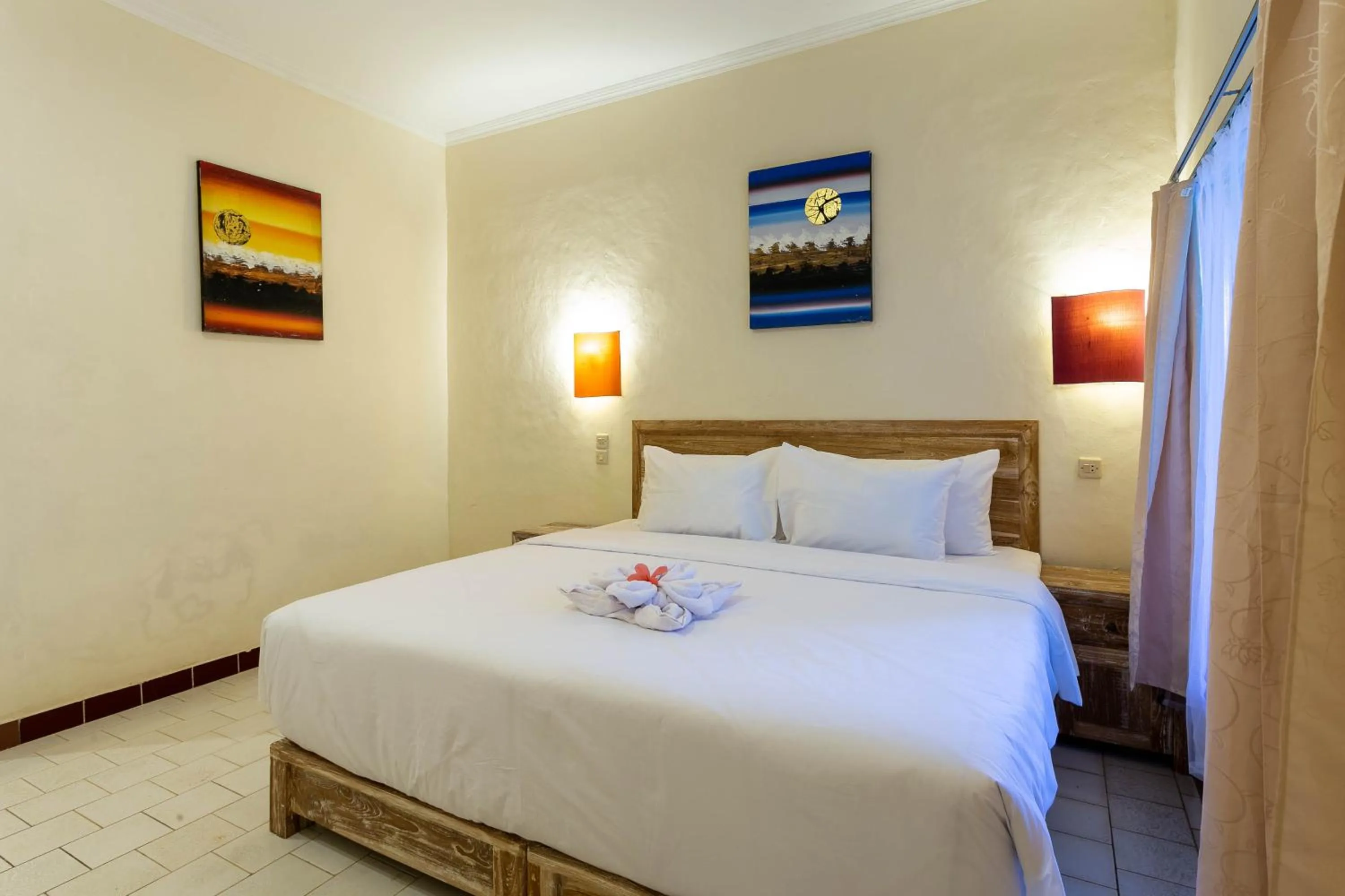 Bed in Utama Villas Beach Front Candidasa