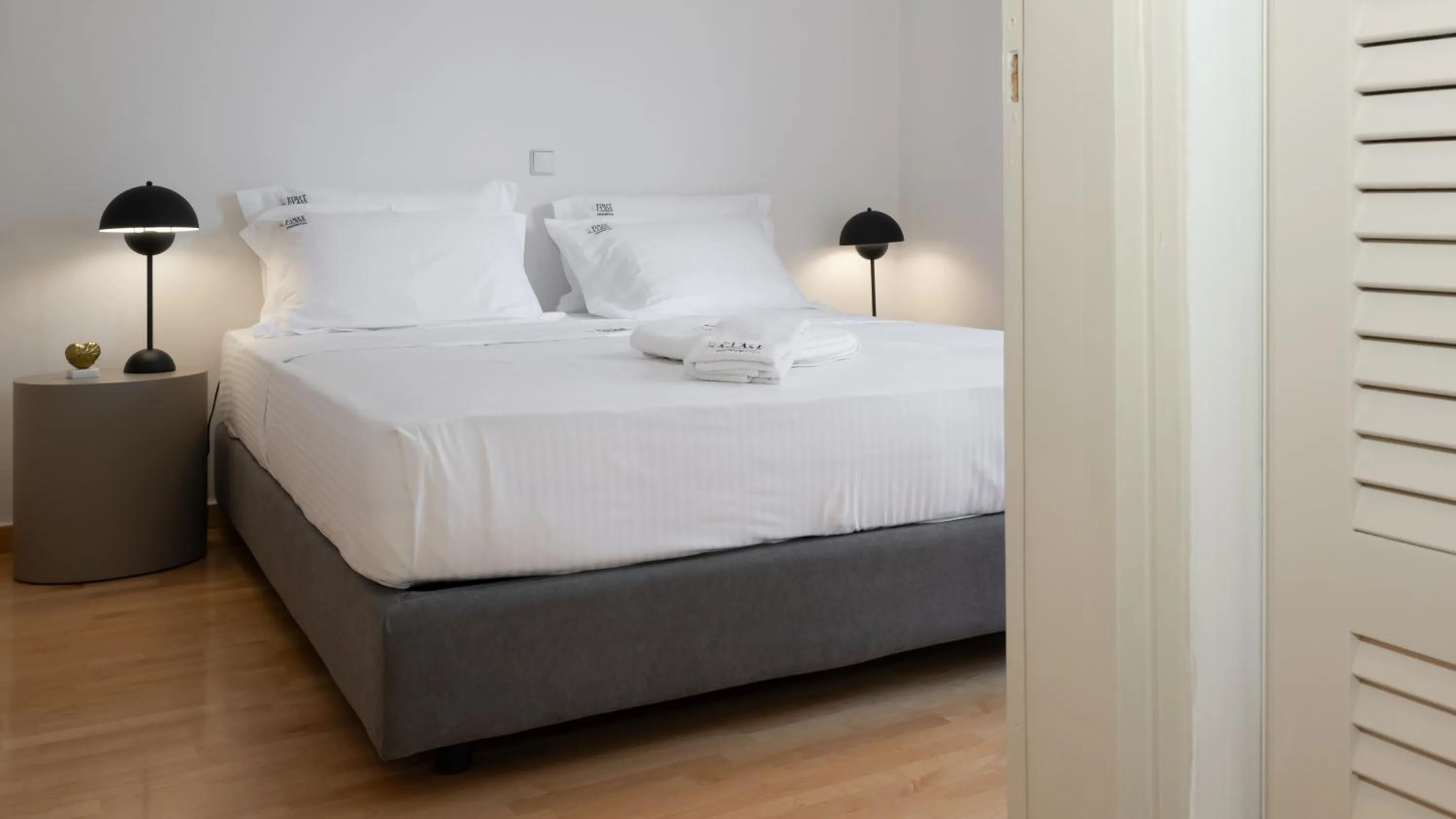 Bed in Vouliagmeni Honeymoon Suite by First Class Properties