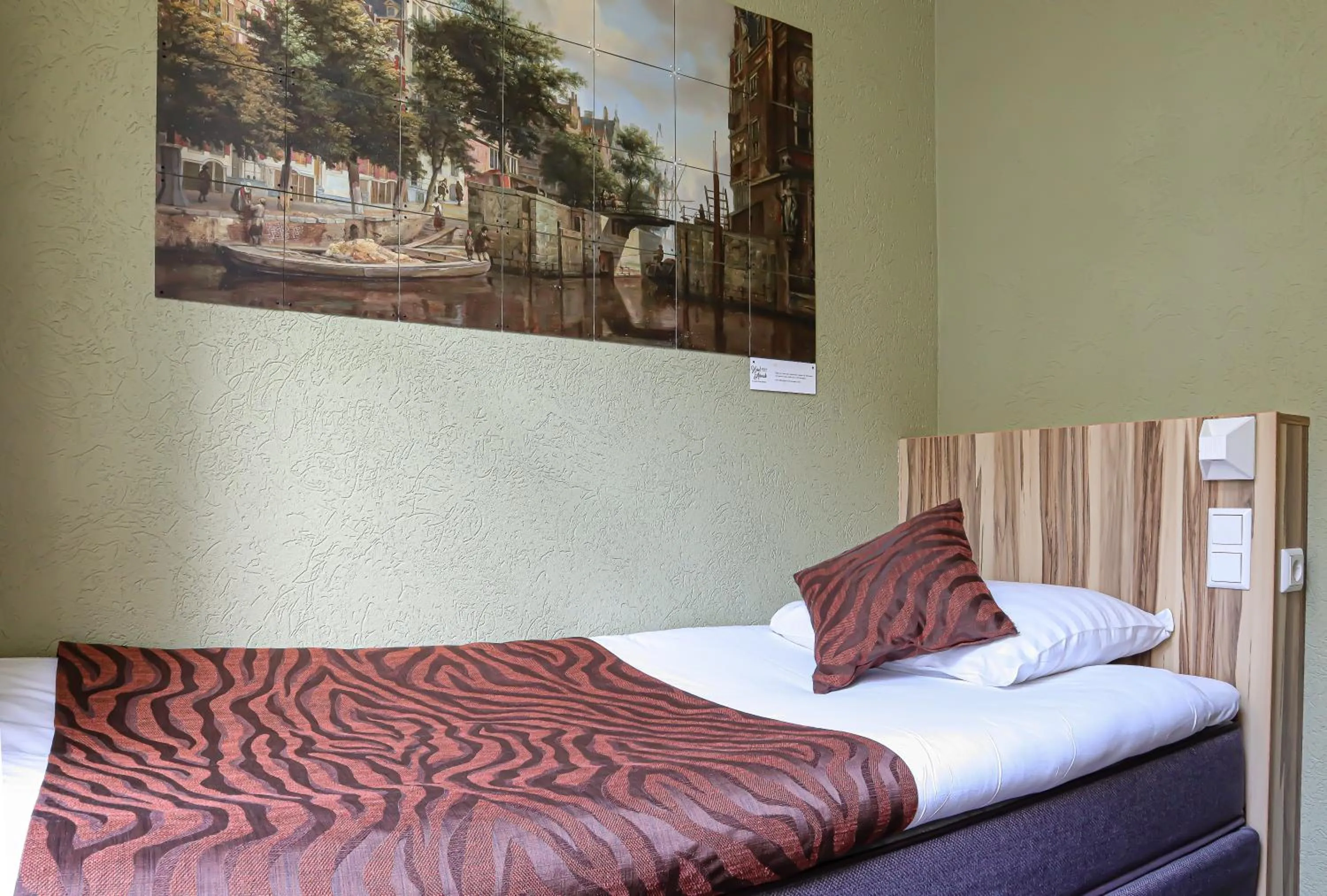 Bed in Hotel Asterisk, a family run hotel