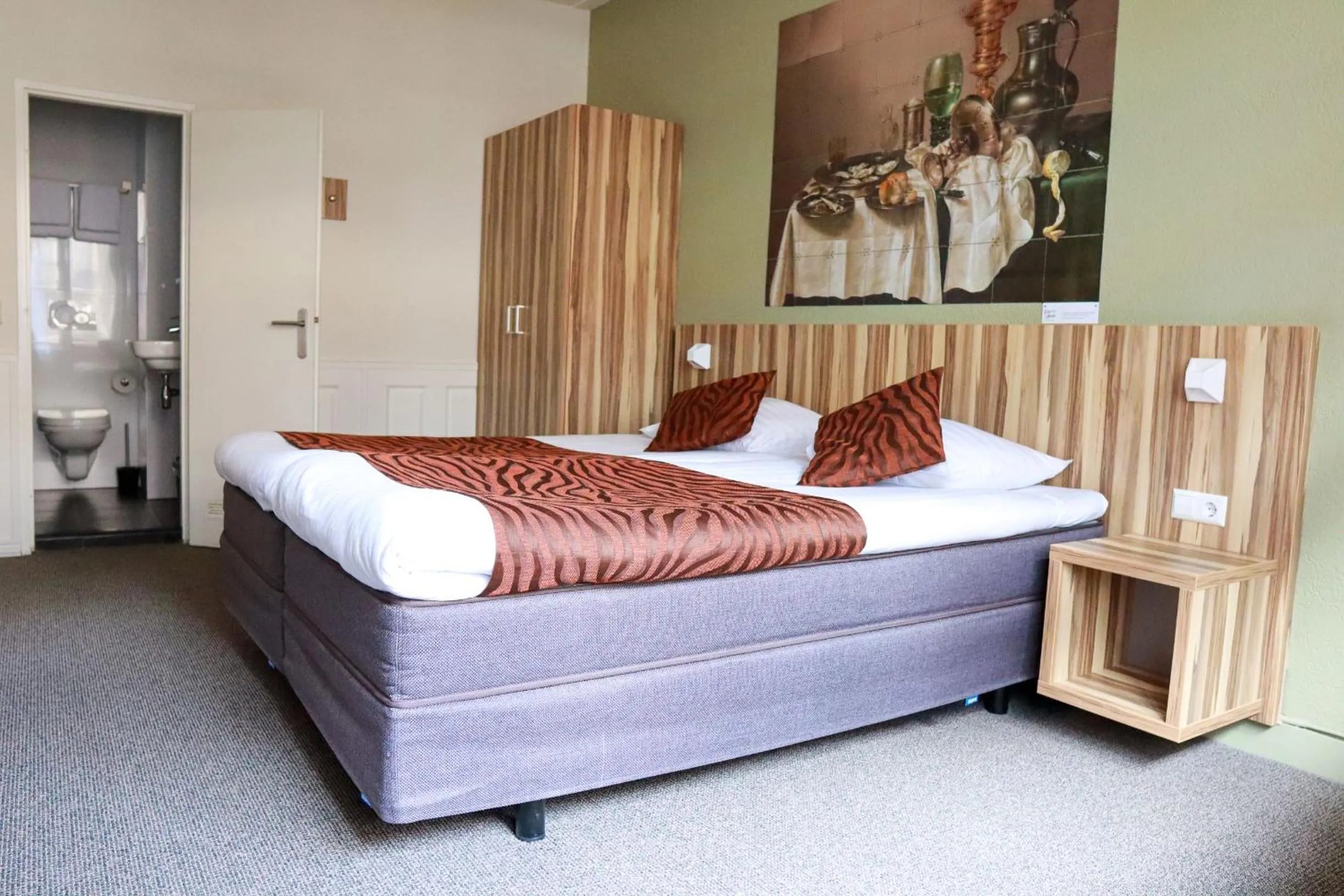 Property building, Bed in Hotel Asterisk, a family run hotel