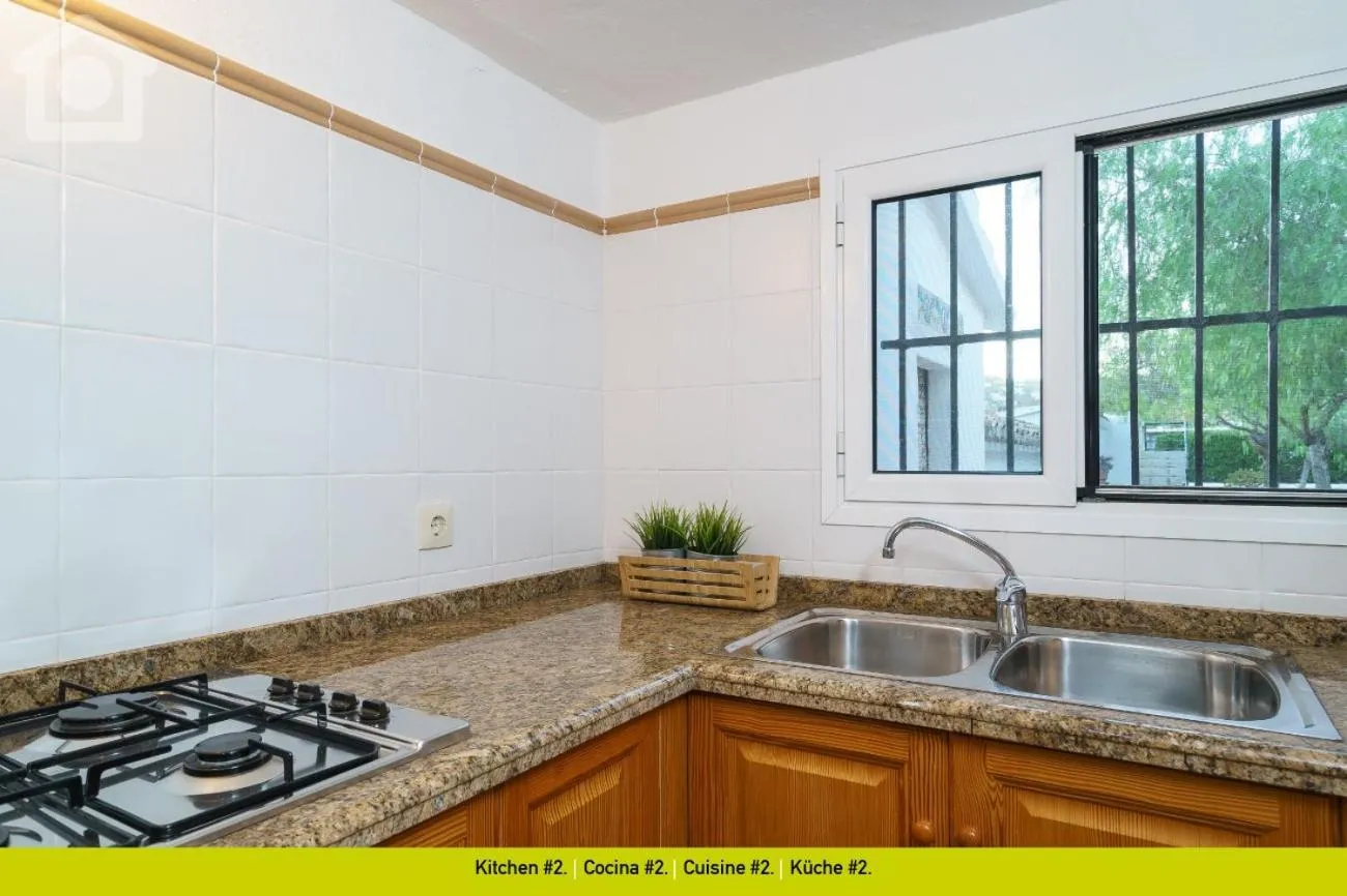 Kitchen or kitchenette in SolHabitat Villa La Andana