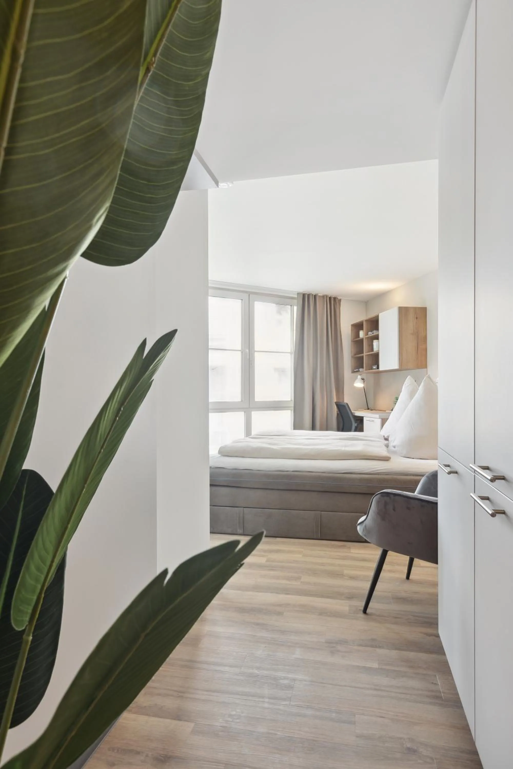 wardrobe, Bed in Home and CoLiving Bonn I Aparthotel