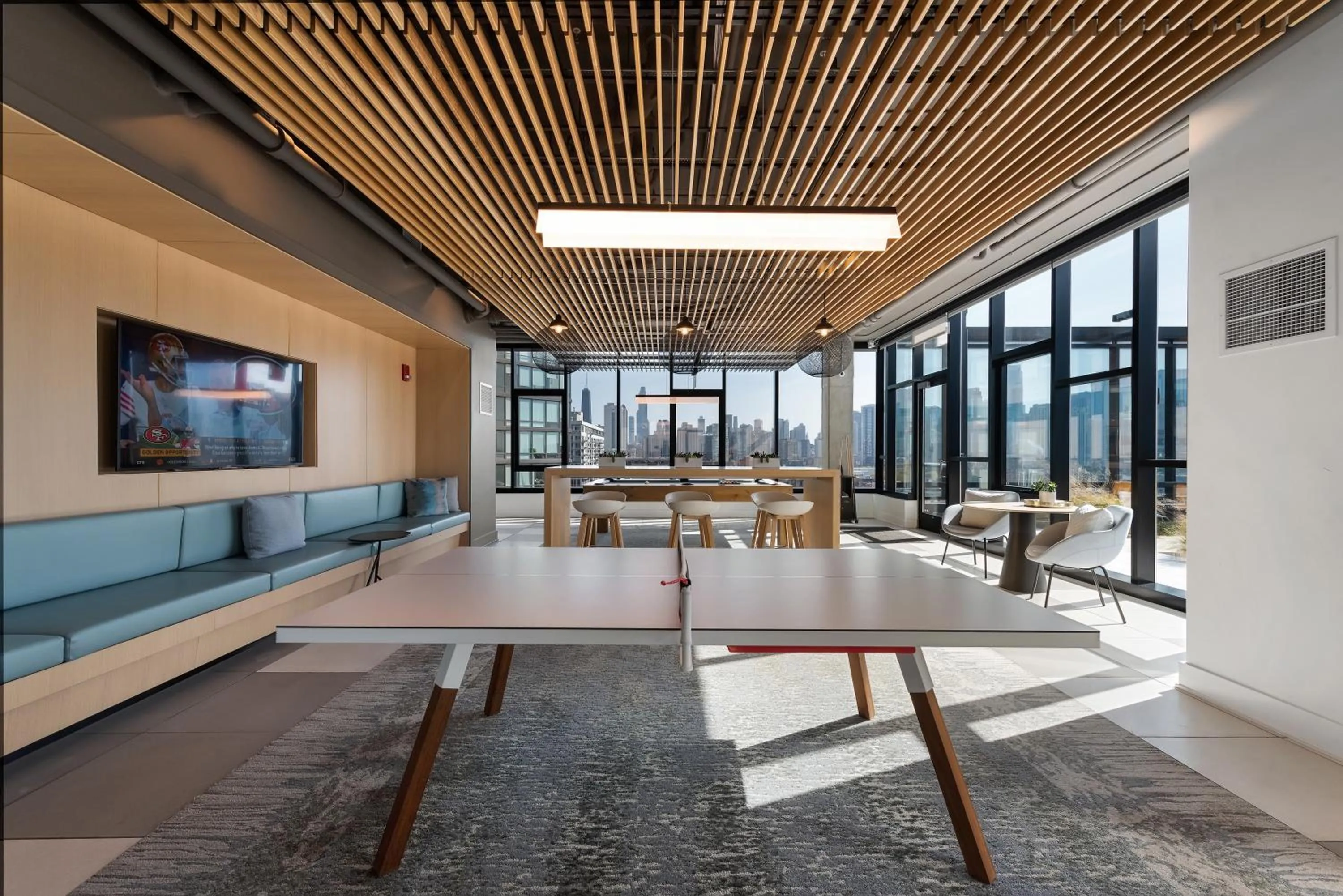 Table tennis in Avenir West Loop Penthouses with Iconic City Views